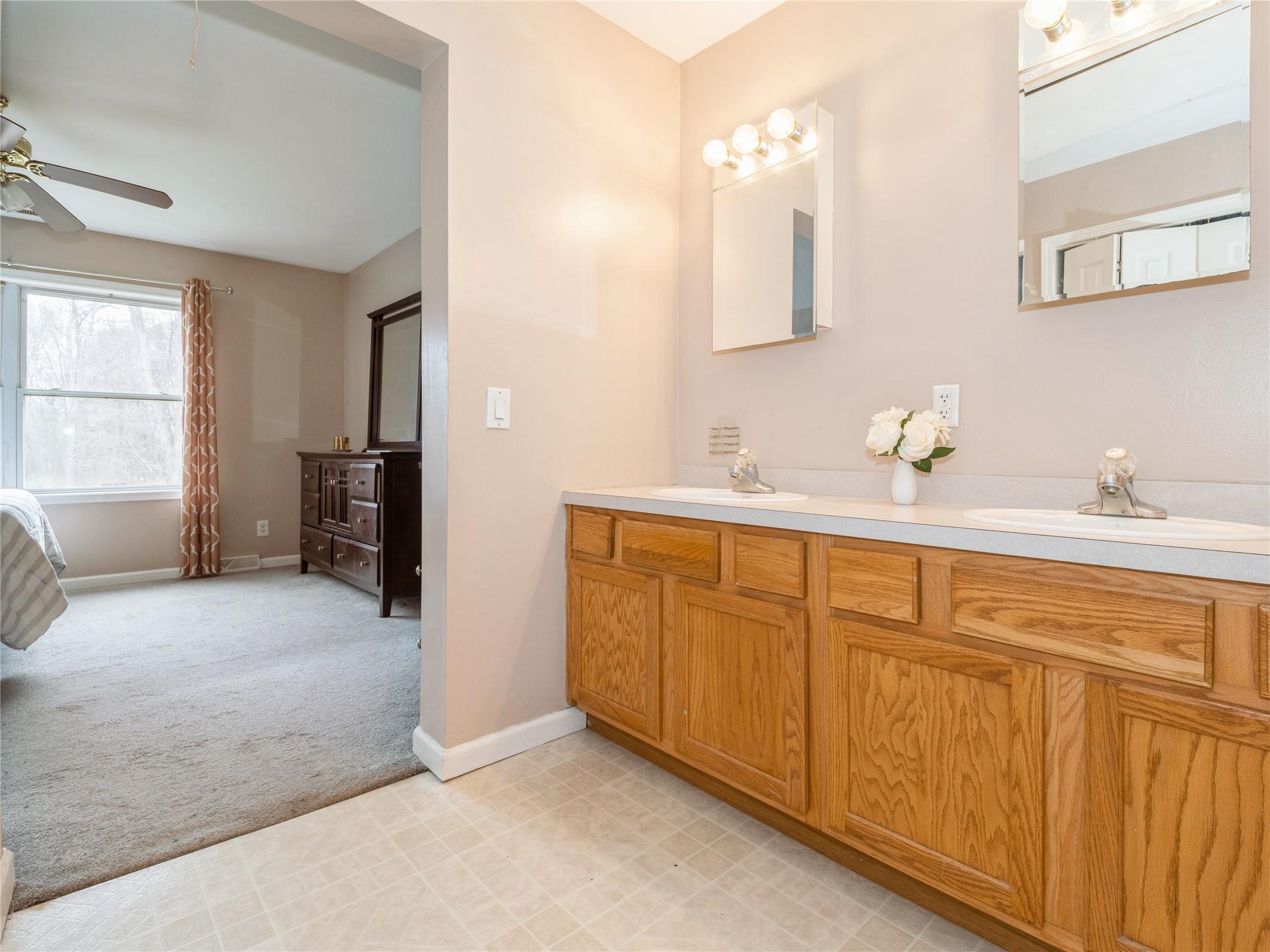 29 Dandelion Lane Wallkill, NY 12589 - Photo 11 of 50 a bathroom with a sink vanity and mirror