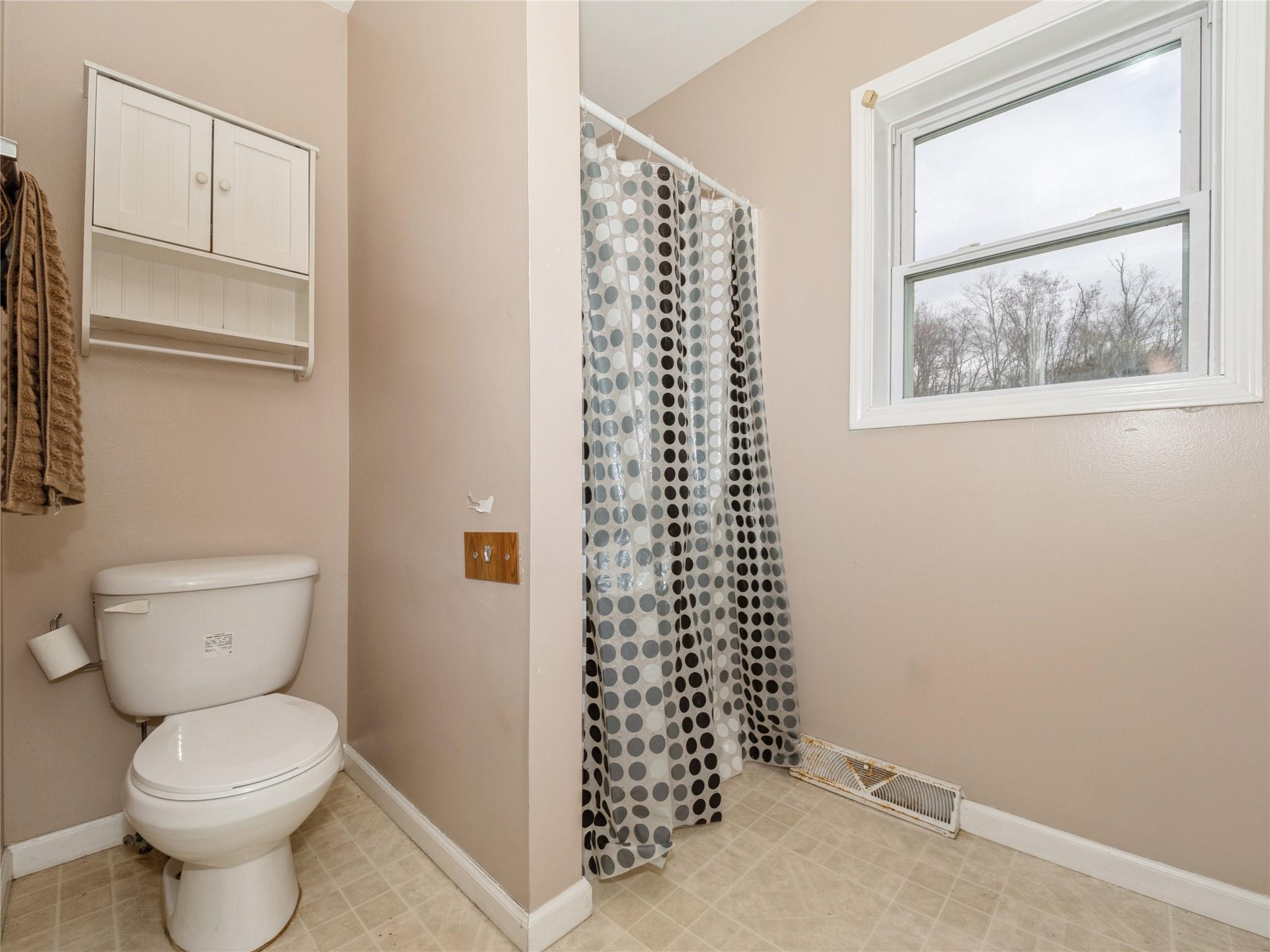 29 Dandelion Lane Wallkill, NY 12589 - Photo 12 of 50 a bathroom with a toilet a sink and a window