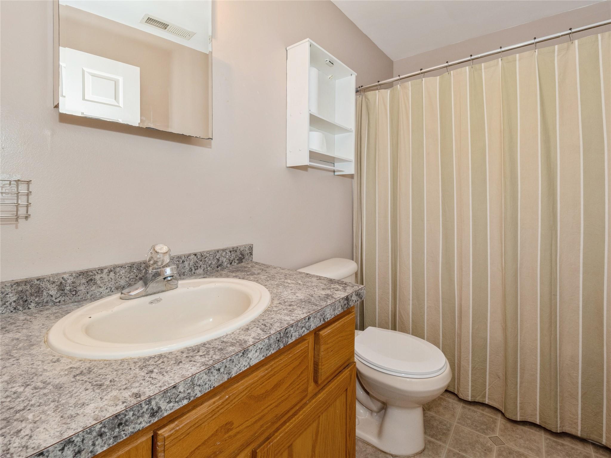 29 Dandelion Lane Wallkill, NY 12589 - Photo 16 of 50 a bathroom with a granite countertop sink toilet and a mirror