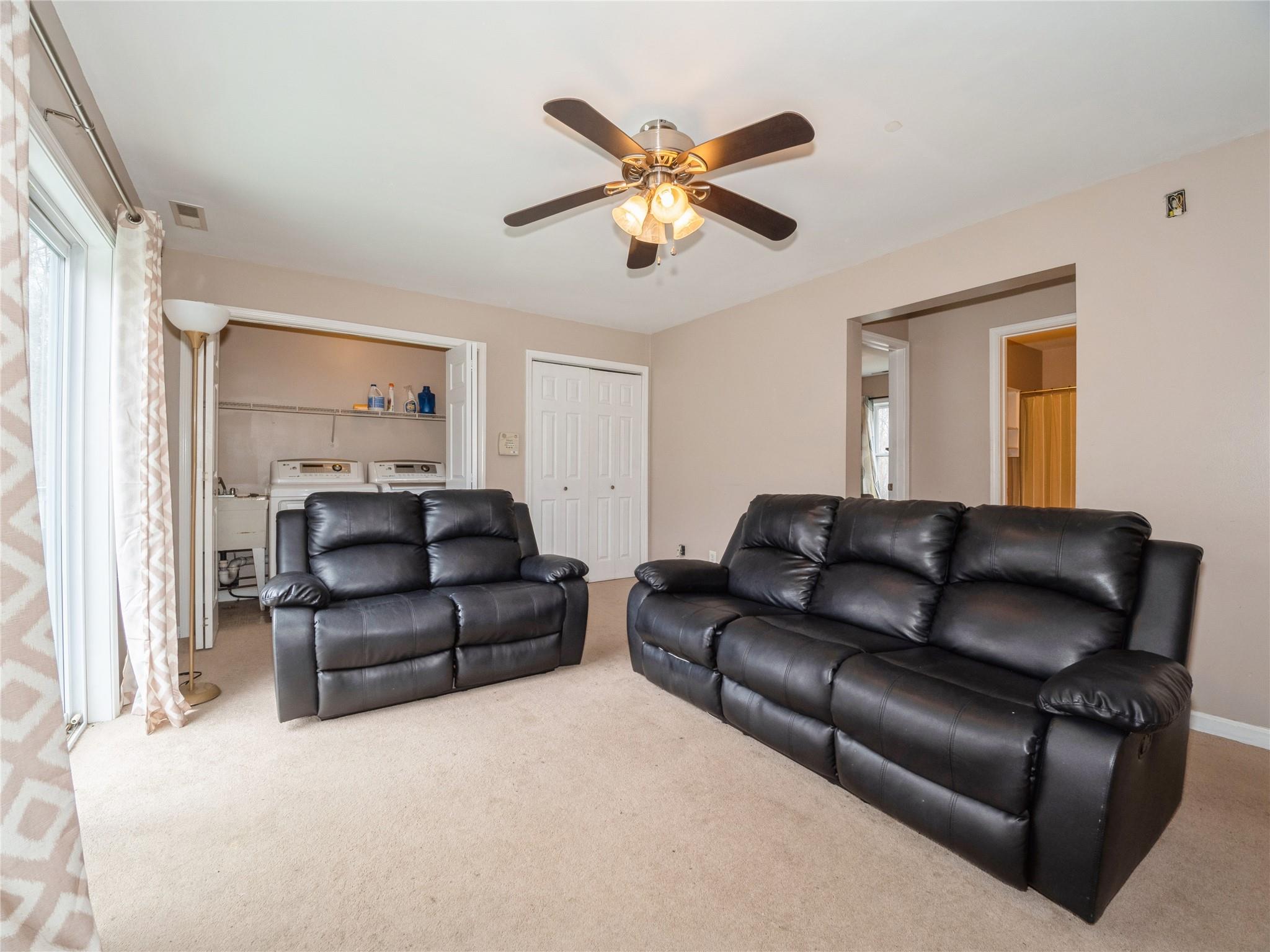 29 Dandelion Lane Wallkill, NY 12589 - Photo 18 of 50 a living room with furniture and a ceiling fan
