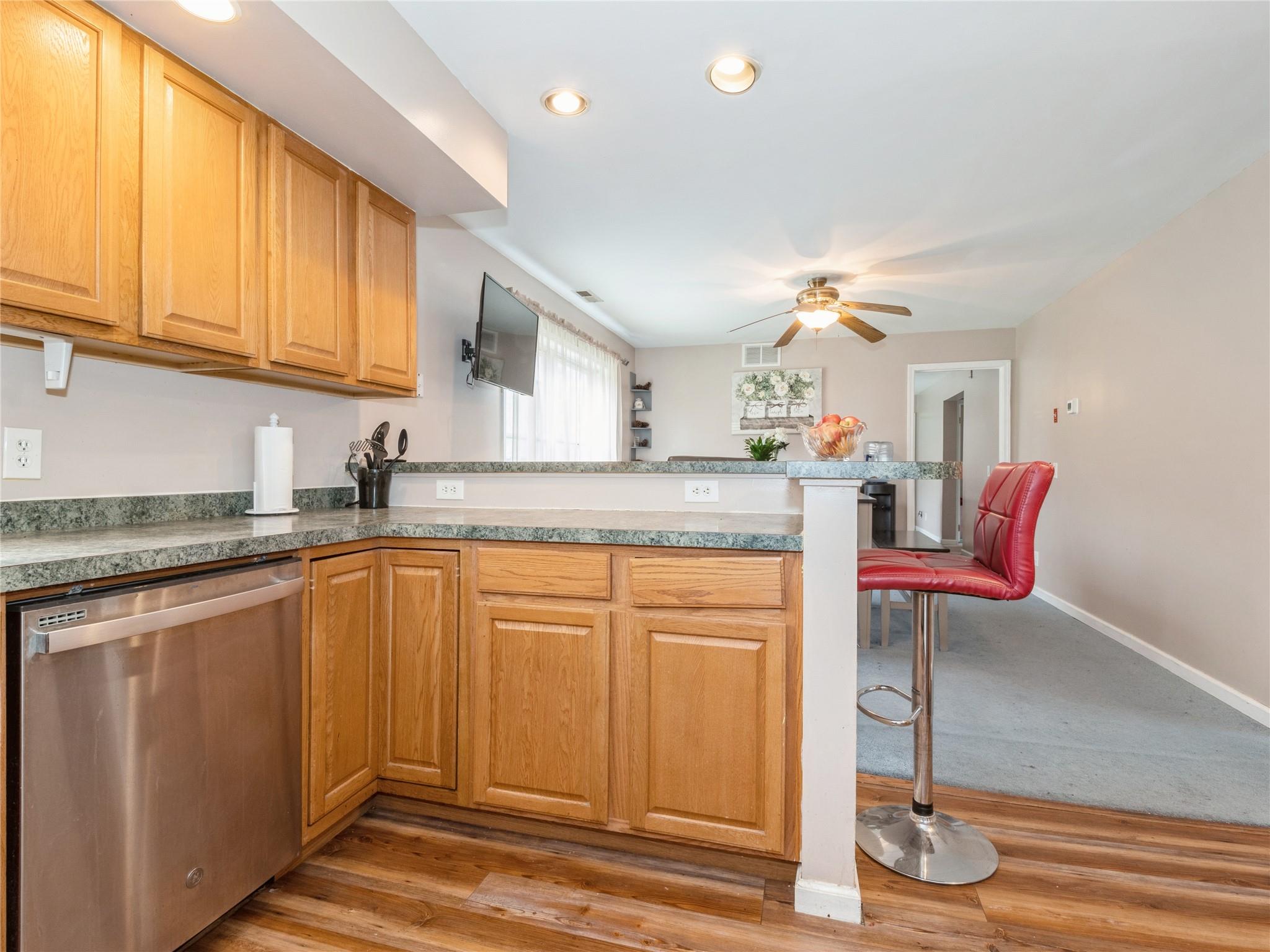 29 Dandelion Lane Wallkill, NY 12589 - Photo 23 of 50 a kitchen with stainless steel appliances granite countertop a sink and cabinets