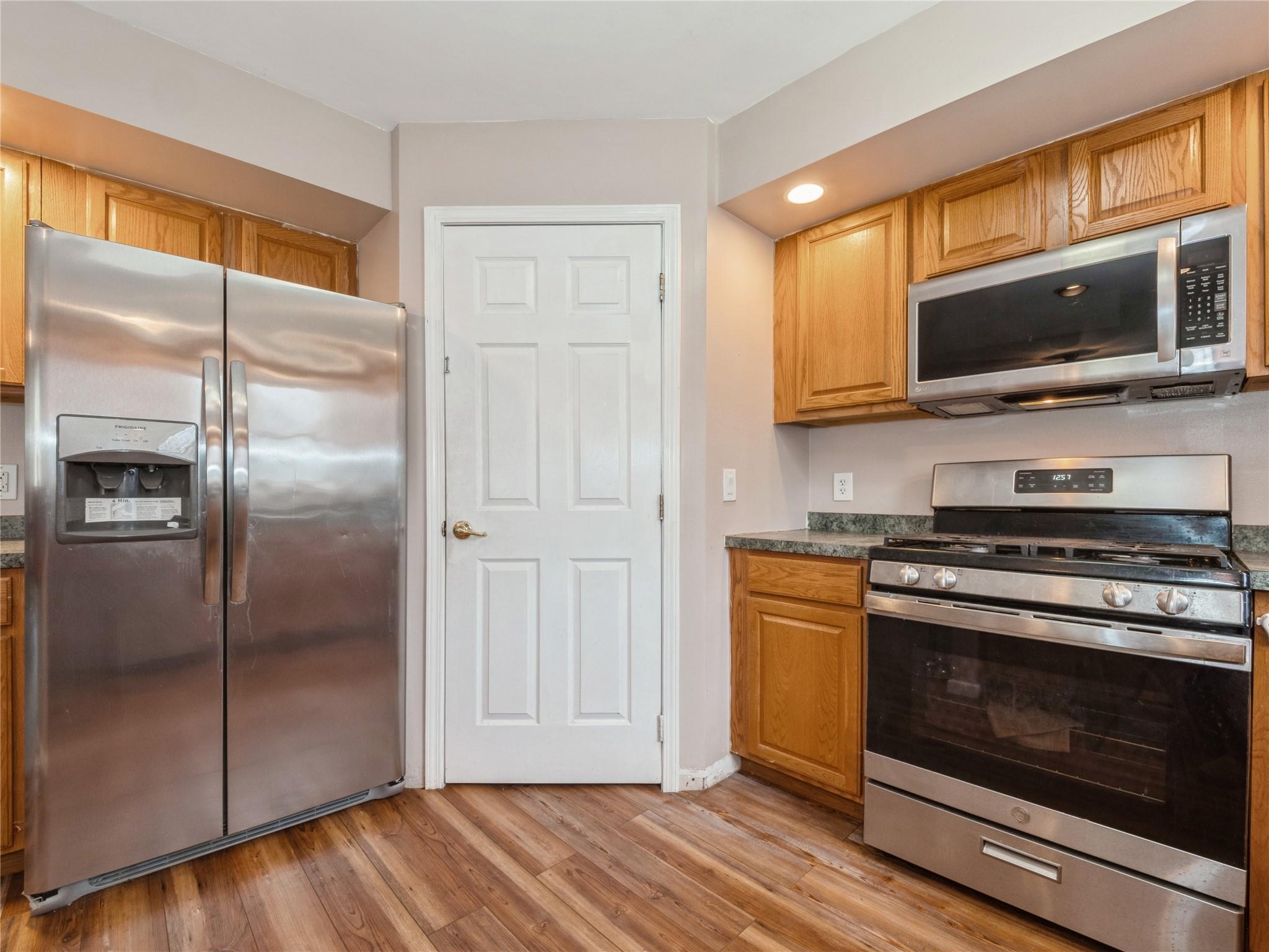 29 Dandelion Lane Wallkill, NY 12589 - Photo 25 of 50 a kitchen with stainless steel appliances a stove microwave and refrigerator