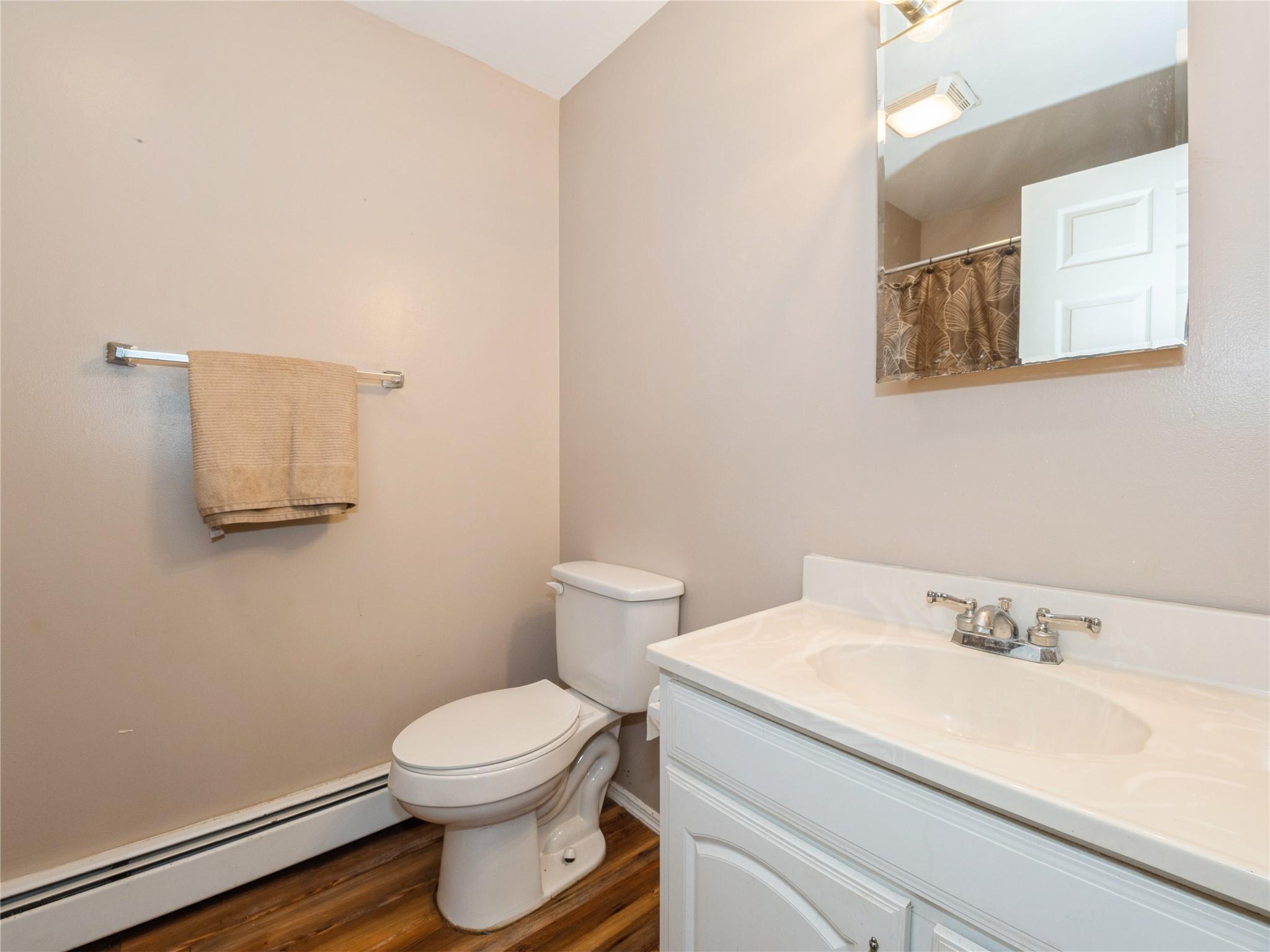 29 Dandelion Lane Wallkill, NY 12589 - Photo 29 of 50 a bathroom with a toilet a sink and mirror