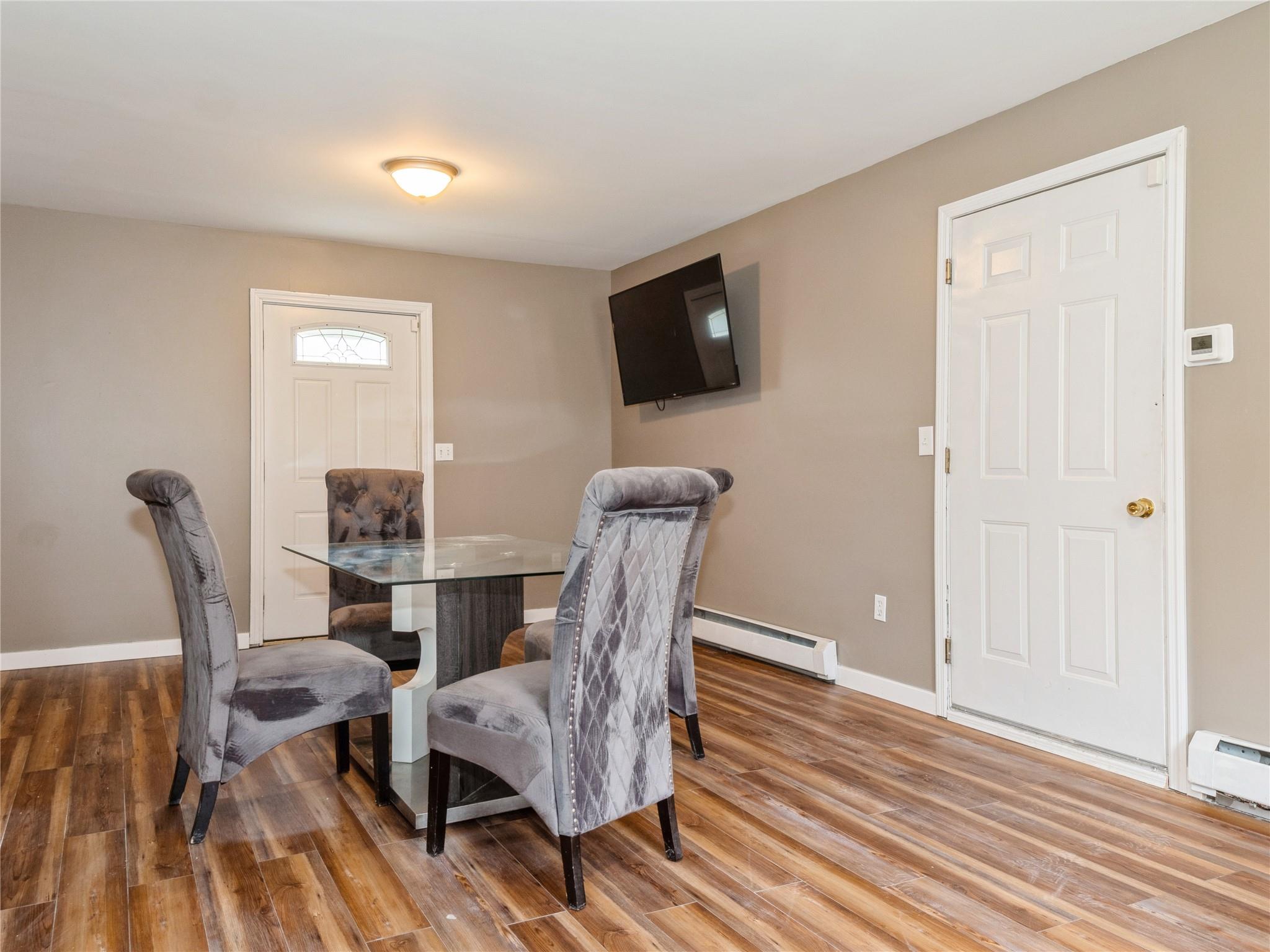 29 Dandelion Lane Wallkill, NY 12589 - Photo 31 of 50 a dining room with furniture and wooden floor