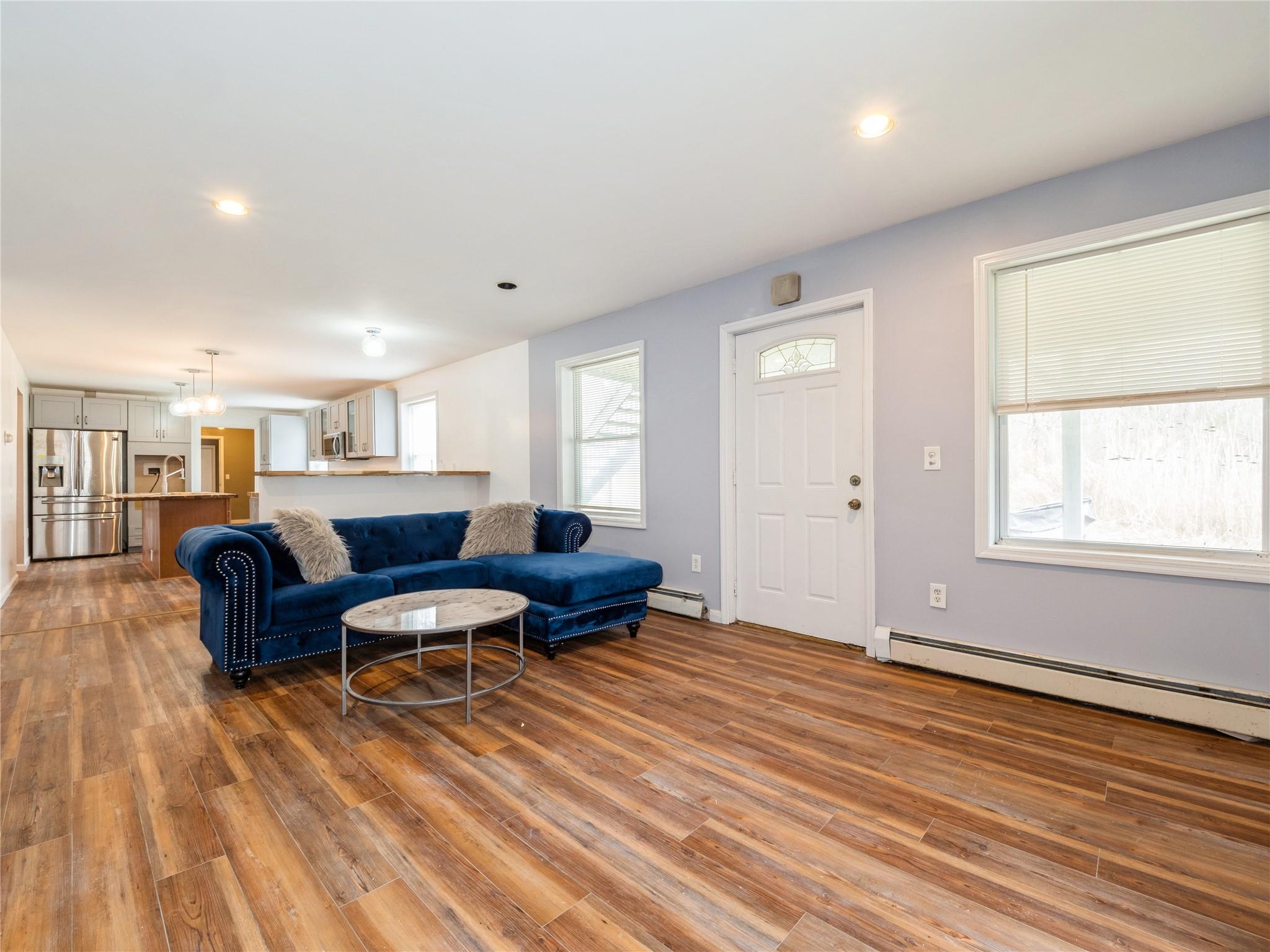 29 Dandelion Lane Wallkill, NY 12589 - Photo 33 of 50 a living room with furniture and a wooden floor