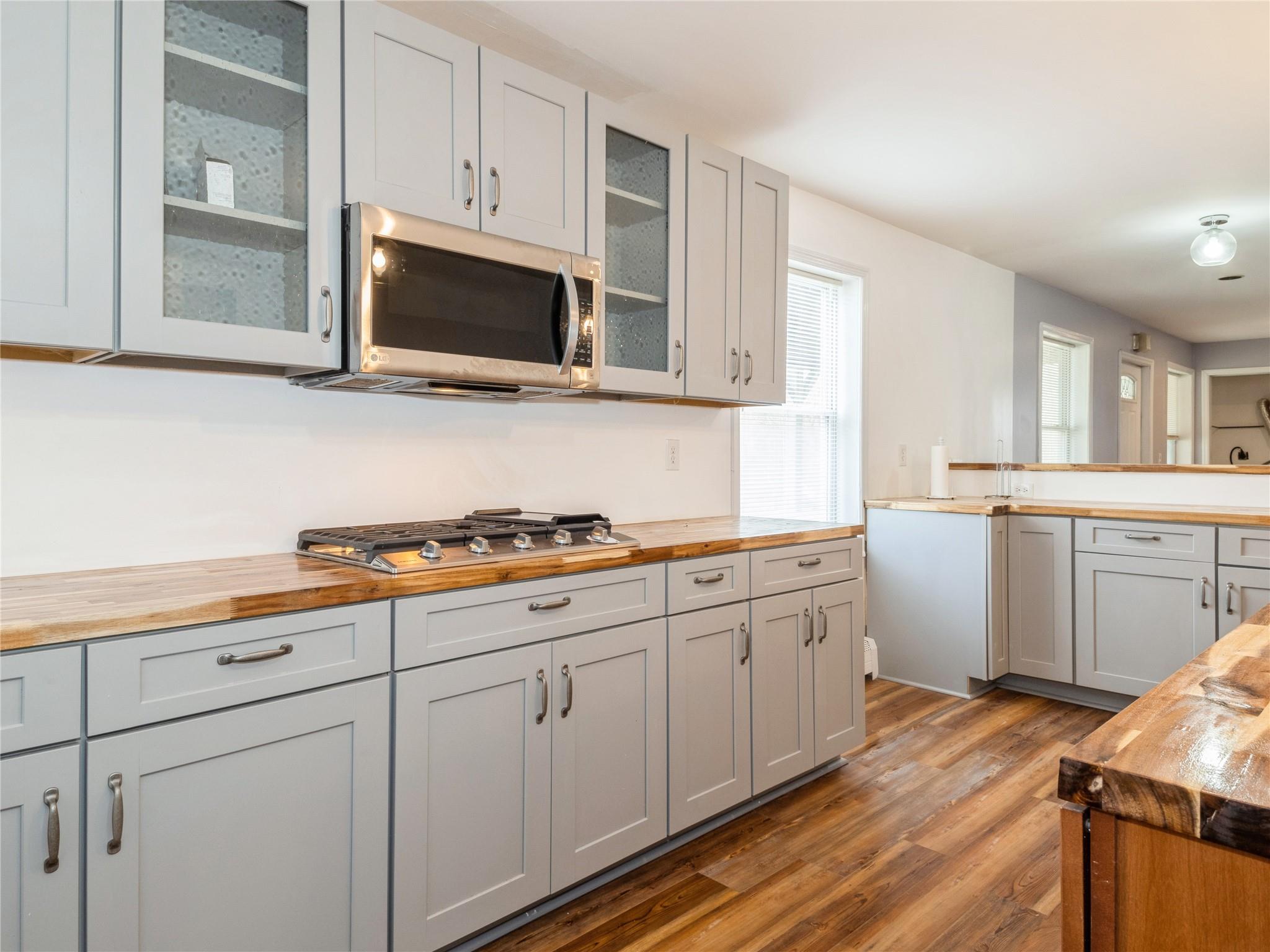 29 Dandelion Lane Wallkill, NY 12589 - Photo 39 of 50 a kitchen with stainless steel appliances a stove microwave and sink