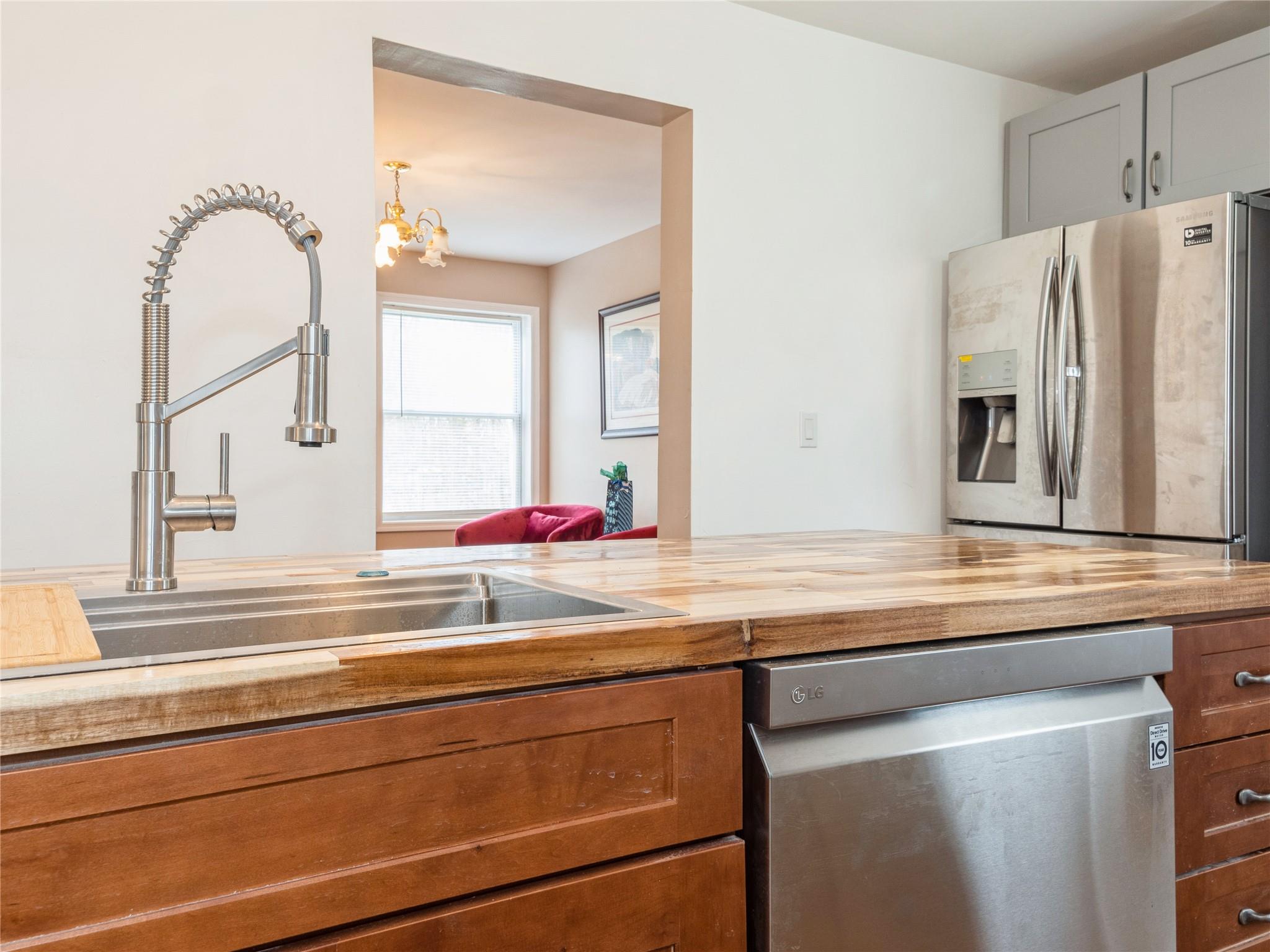 29 Dandelion Lane Wallkill, NY 12589 - Photo 41 of 50 a kitchen with a sink and a refrigerator