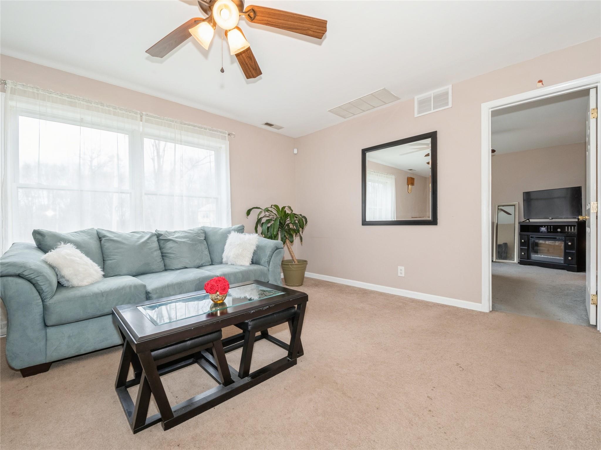 29 Dandelion Lane Wallkill, NY 12589 - Photo 7 of 50 a living room with furniture and a large window