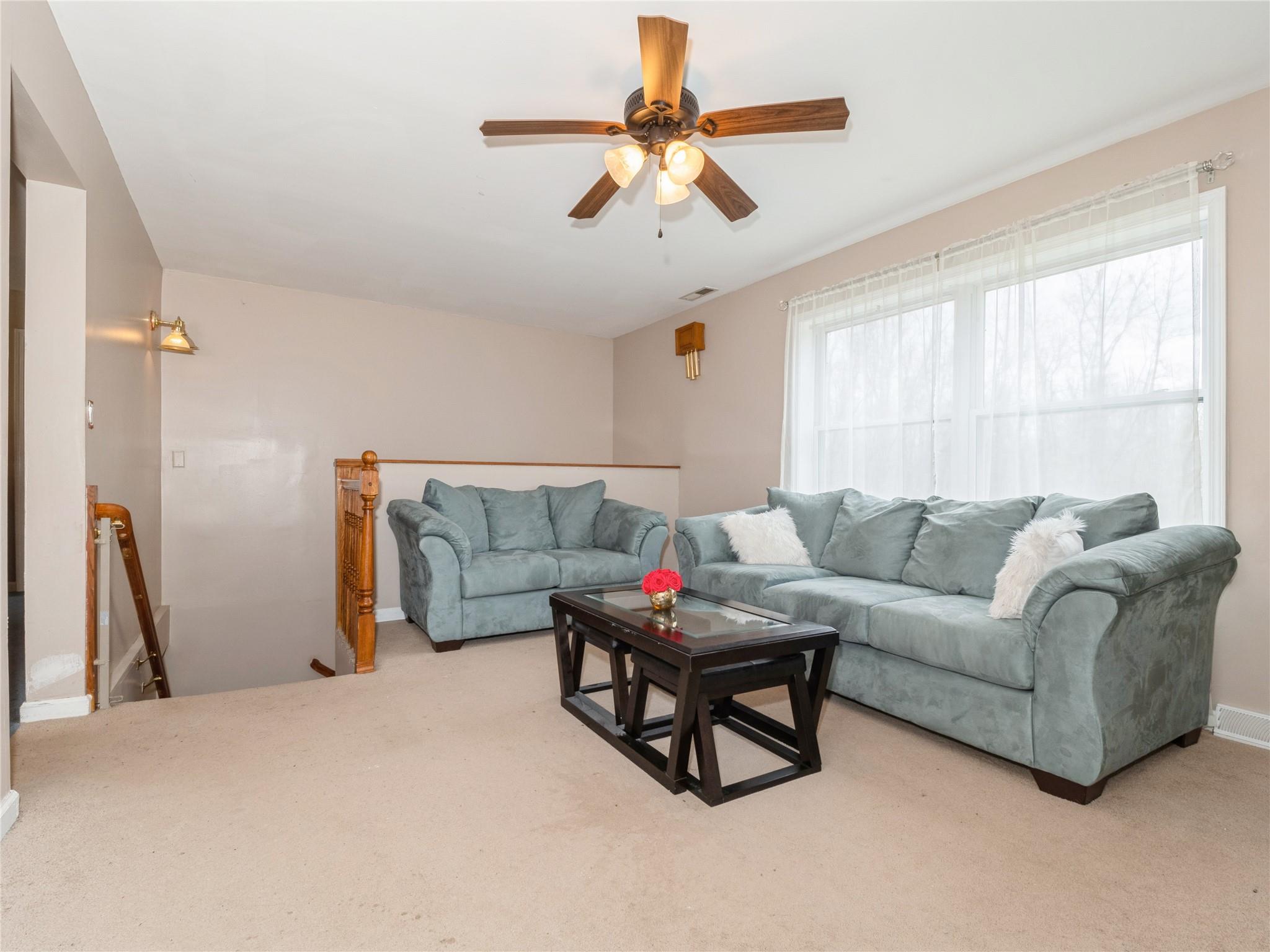 29 Dandelion Lane Wallkill, NY 12589 - Photo 8 of 50 a living room with furniture and a window