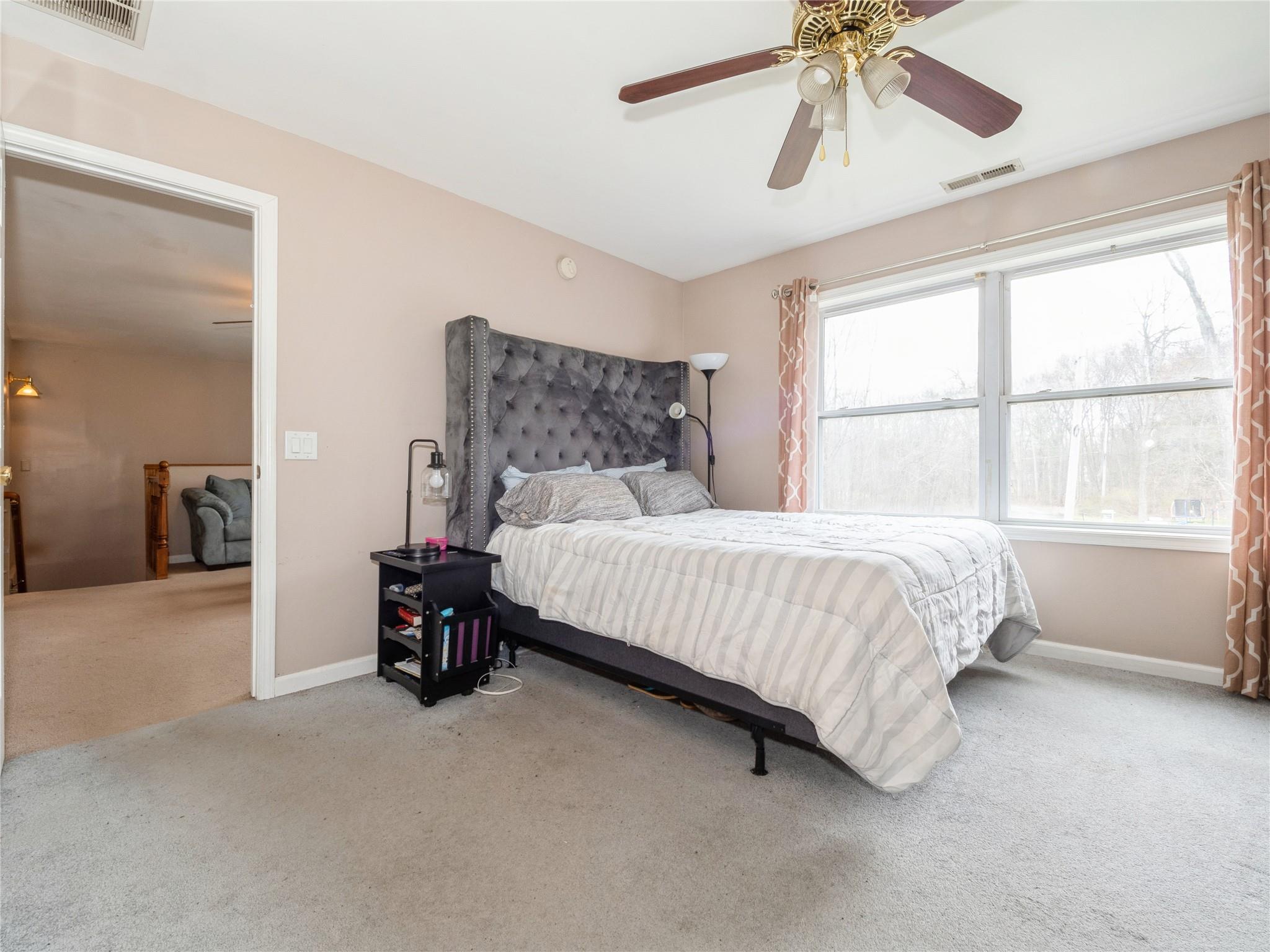 29 Dandelion Lane Wallkill, NY 12589 - Photo 10 of 50 a bedroom with a bed and window