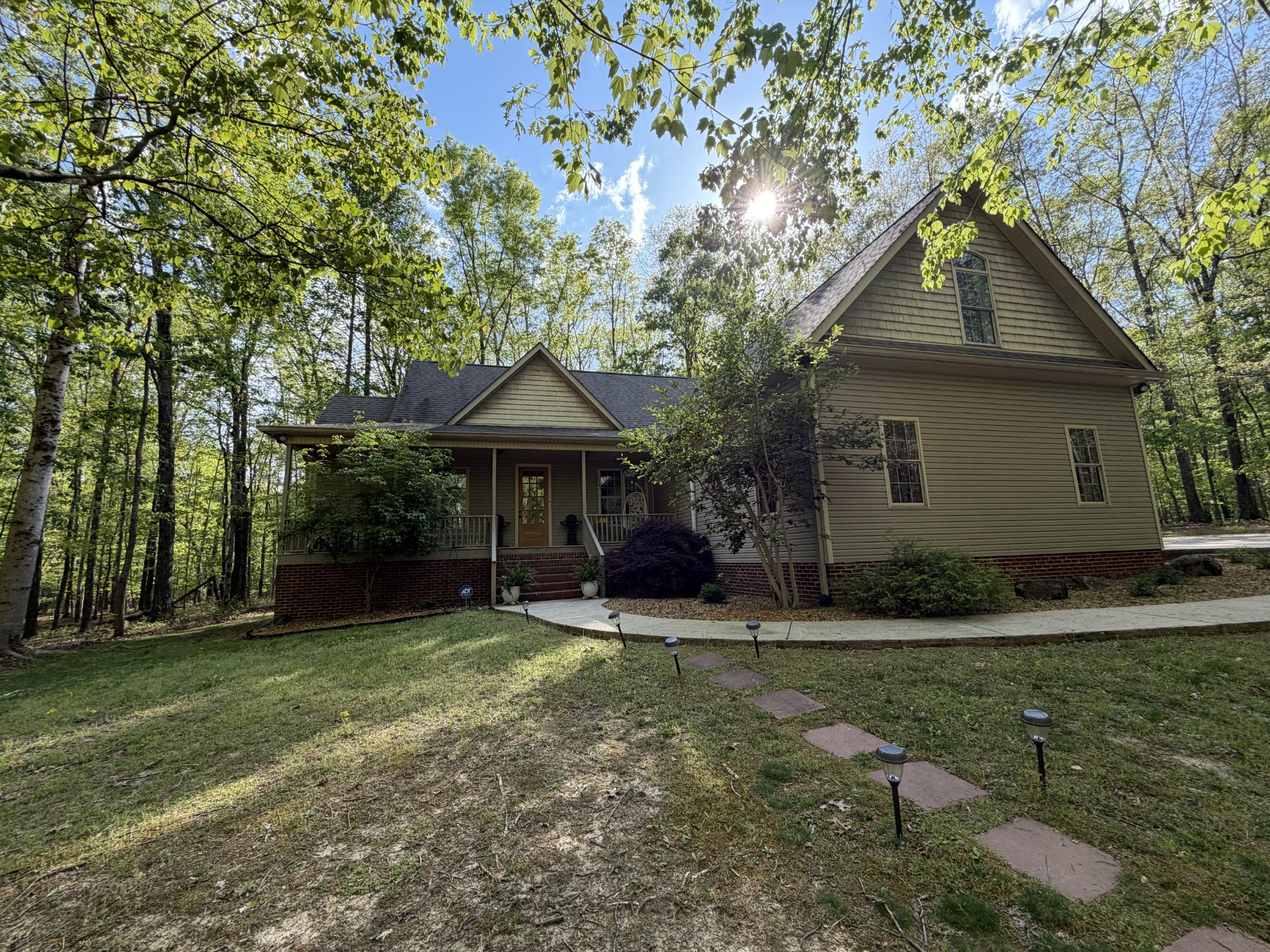 1629 Clifftops Avenue Monteagle, TN 37356 - Photo 1 of 45 a backyard of a house with yard and outdoor seating