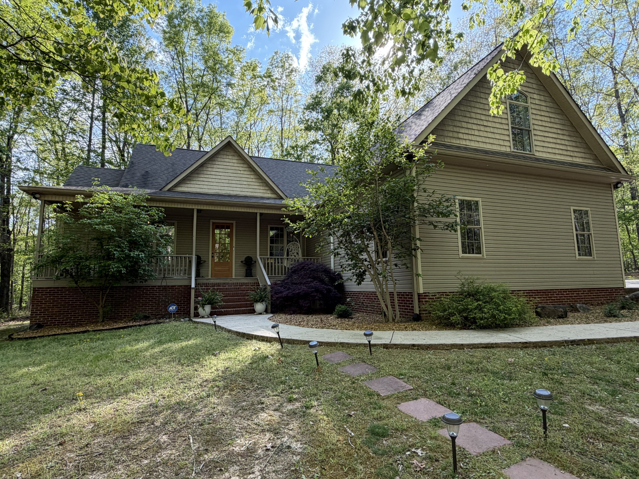 1629 Clifftops Avenue Monteagle, TN 37356 - Photo 2 of 45 a front view of a house with a yard