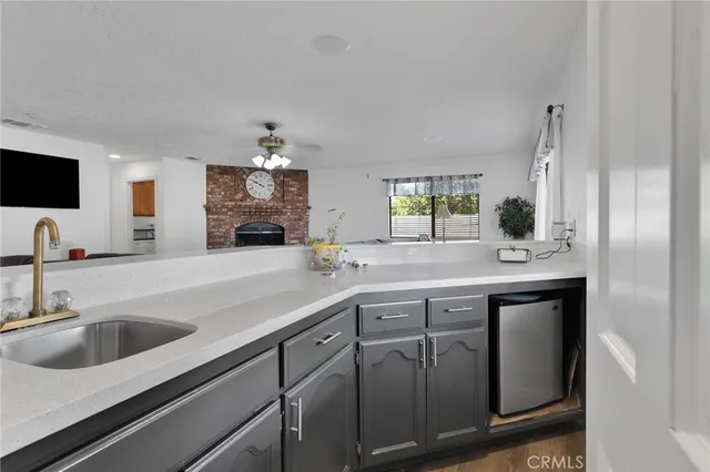 a kitchen with a sink and a stove top oven