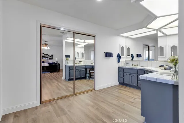 a bathroom with a tub shower and a sink