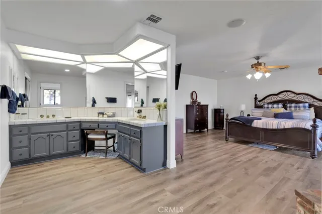 a view of a house with swimming pool and sitting area