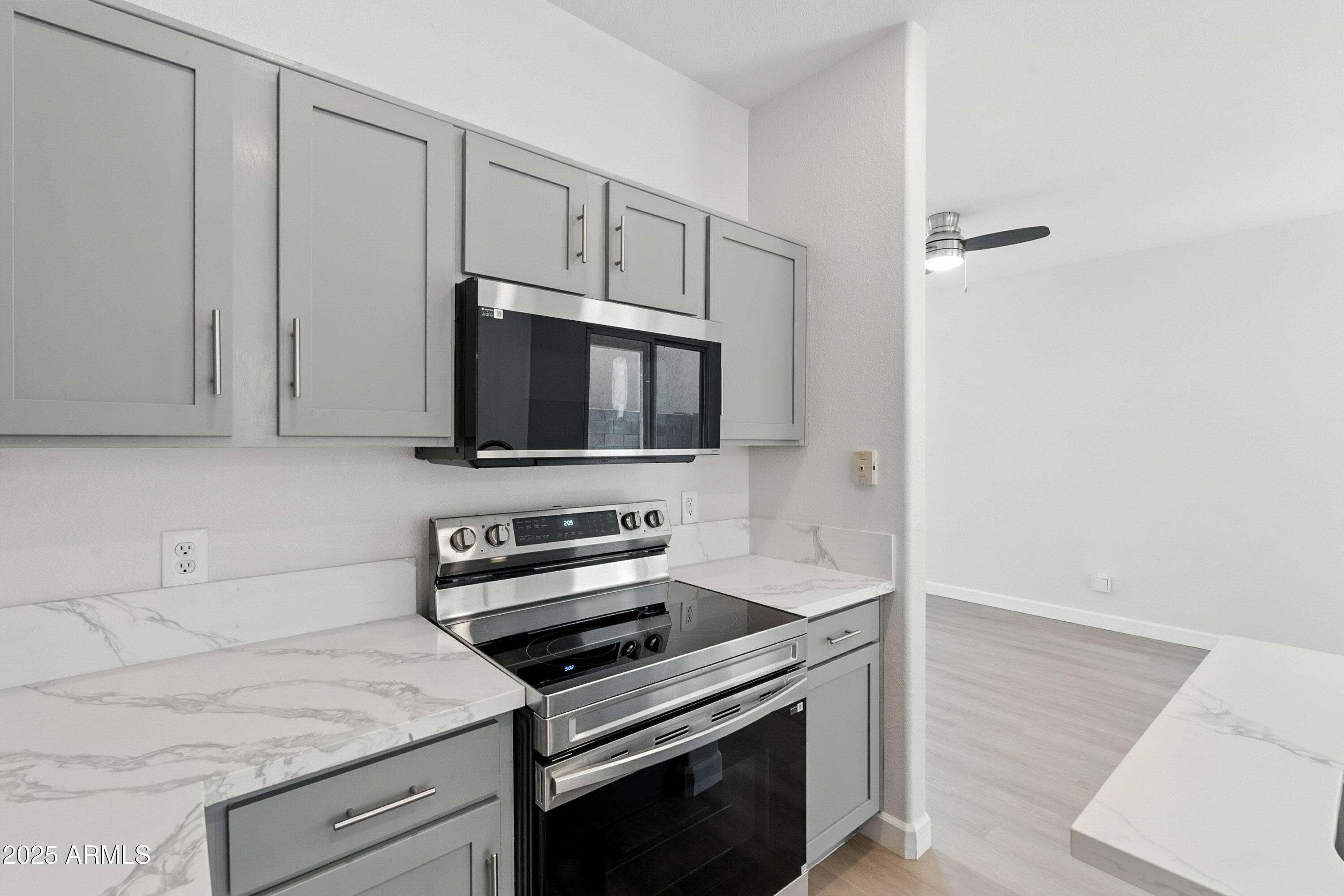 1409 East Bloch Road Phoenix, AZ 85040 - Photo 11 of 24 a kitchen with a stove and a microwave