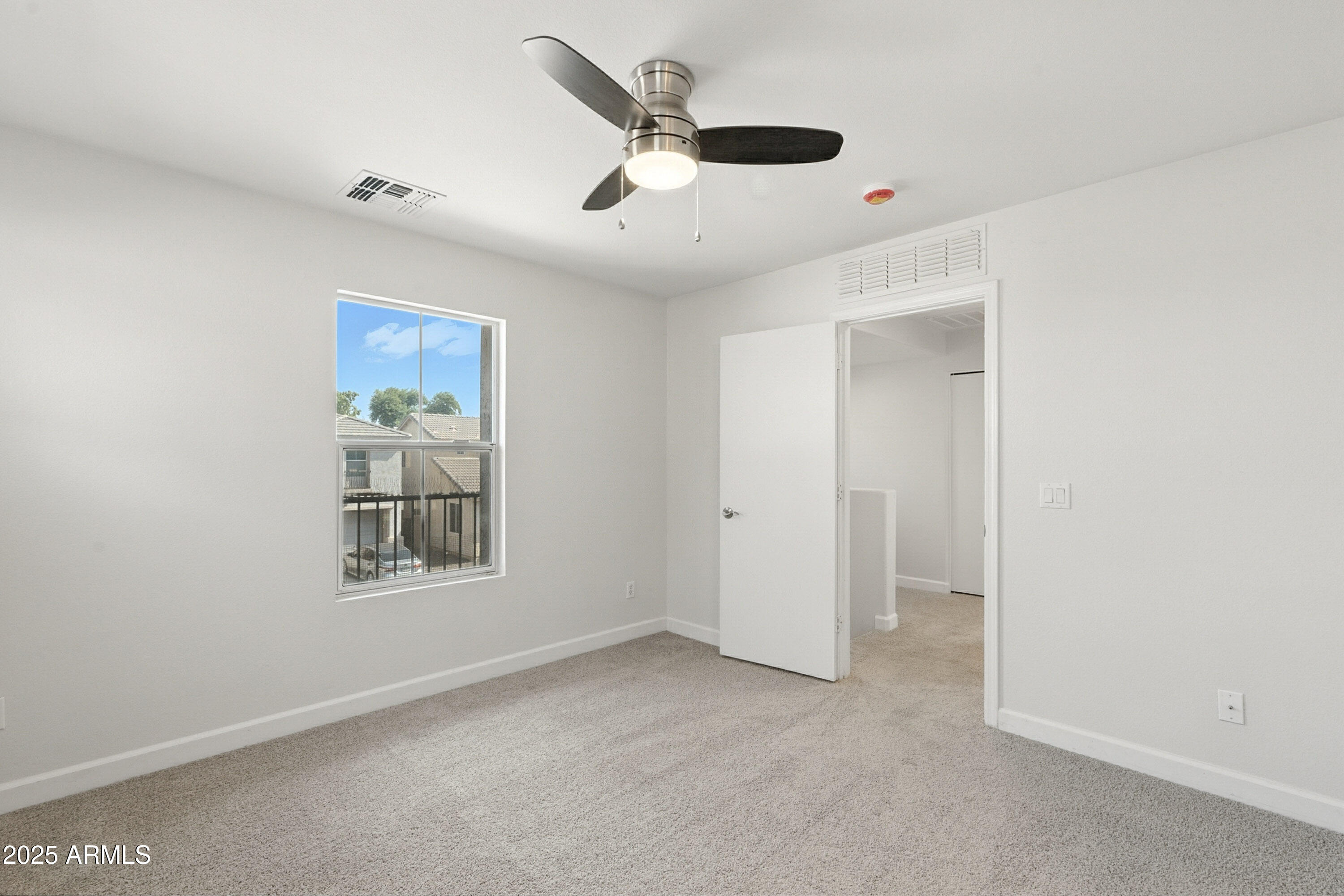 1409 East Bloch Road Phoenix, AZ 85040 - Photo 15 of 24 a view of an empty room with a window