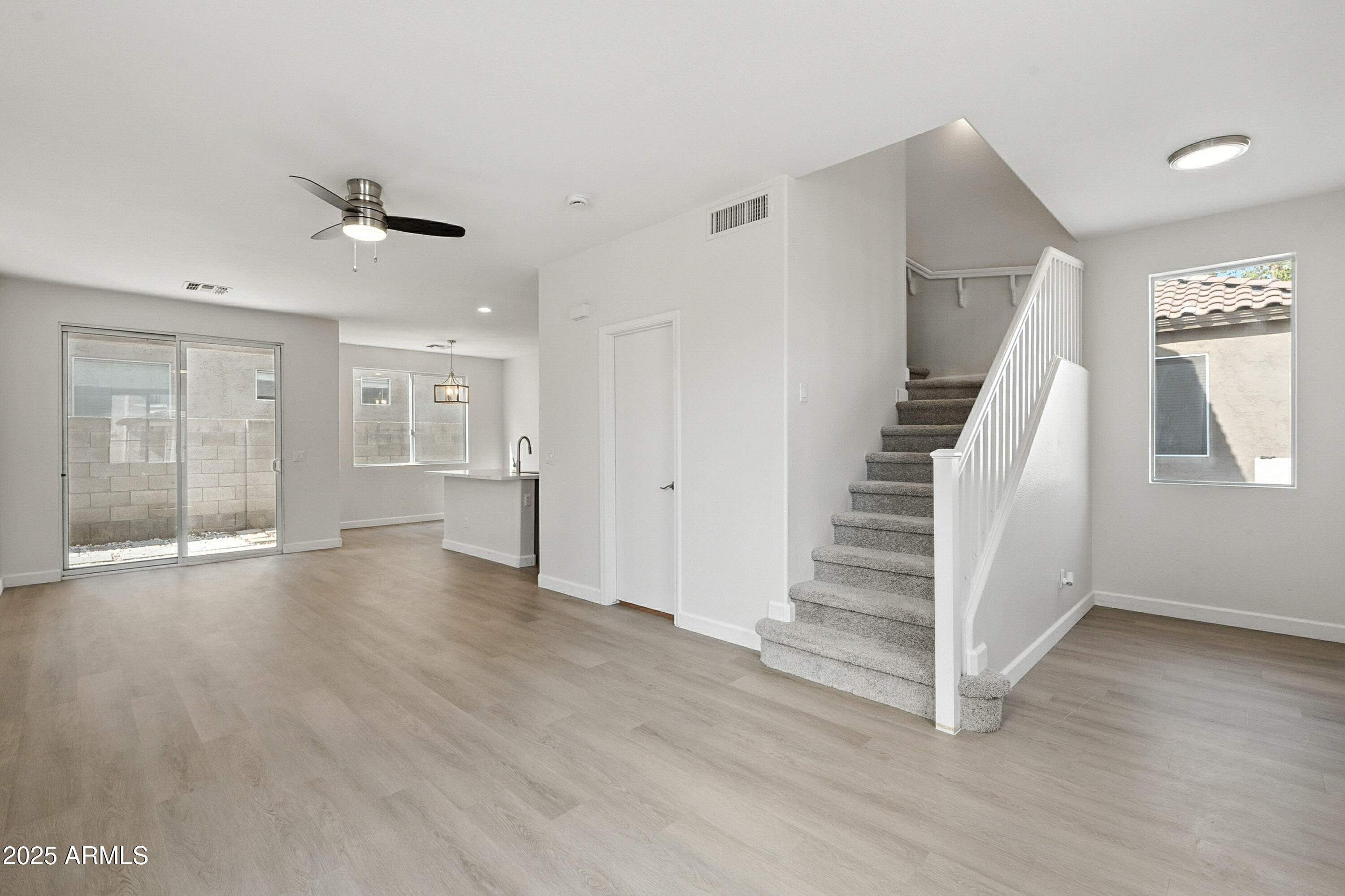 1409 East Bloch Road Phoenix, AZ 85040 - Photo 2 of 24 wooden floor in an empty room with a window