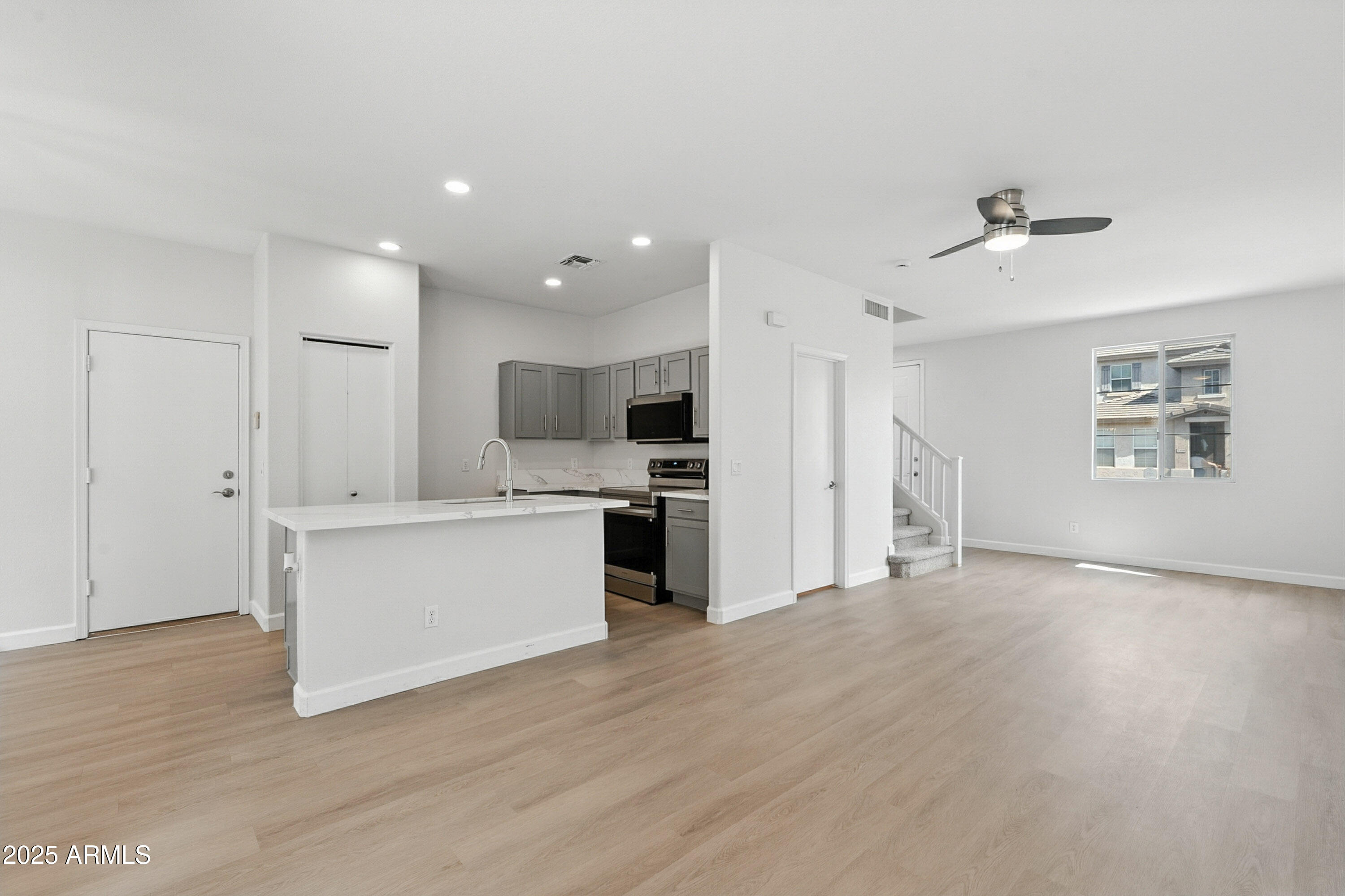 1409 East Bloch Road Phoenix, AZ 85040 - Photo 3 of 24 a view of kitchen with wooden floor and electronic appliances