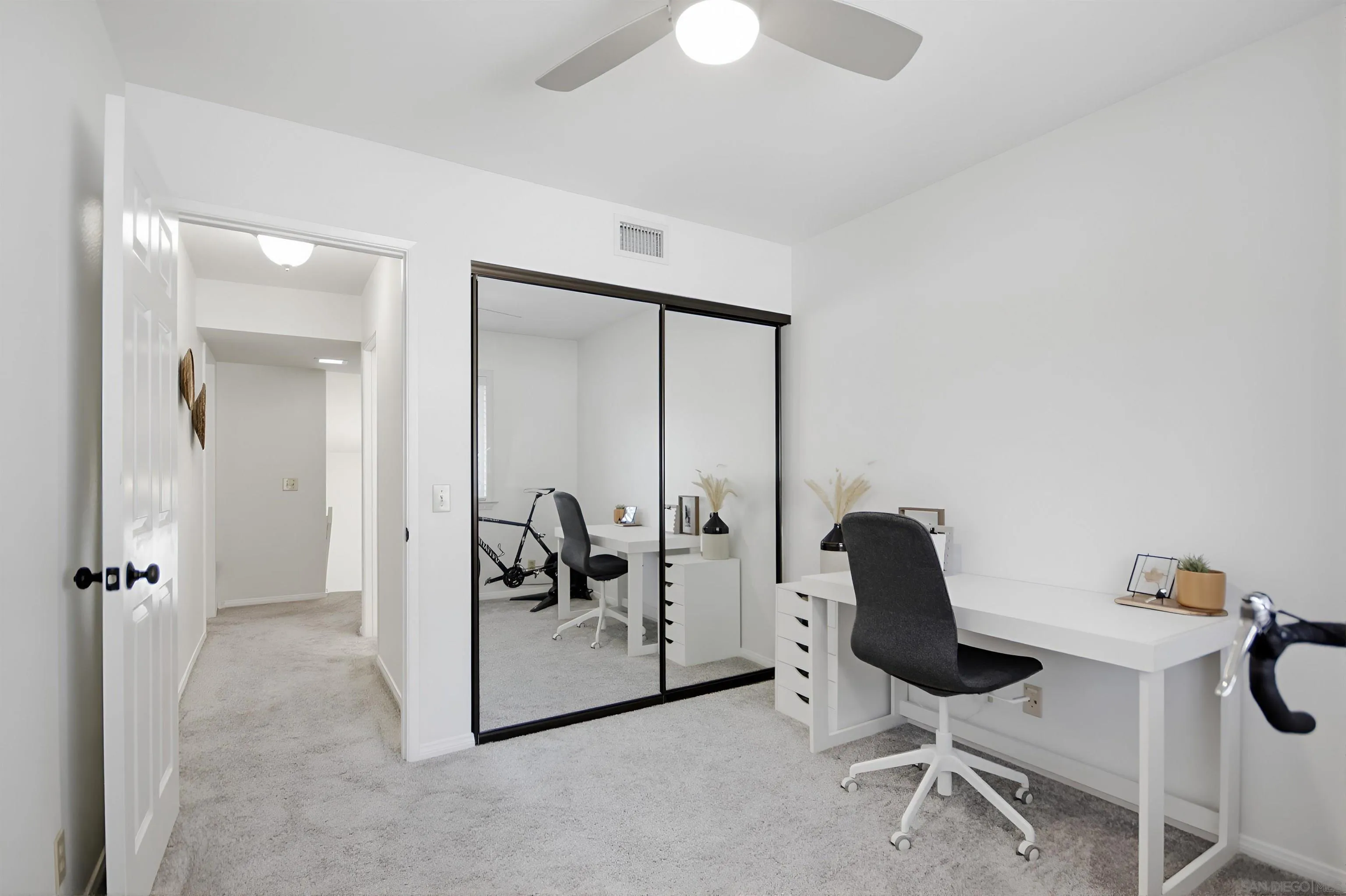 5822 Mission Center Road, Unit A San Diego, CA 92108 - Photo 22 of 35 a view of a workspace with furniture and a bathroom