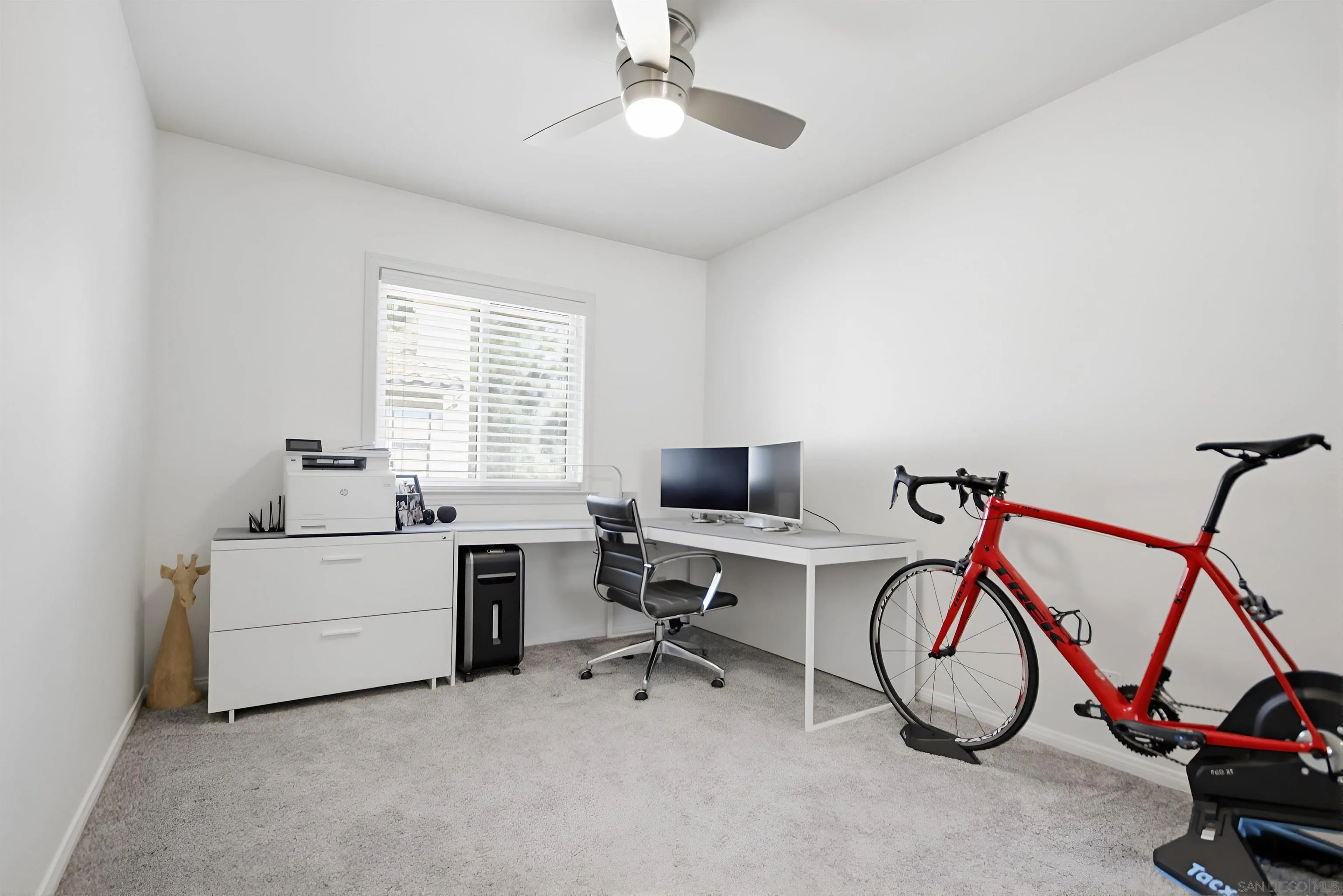 5822 Mission Center Road, Unit A San Diego, CA 92108 - Photo 23 of 35 a view of a workspace with furniture and a window