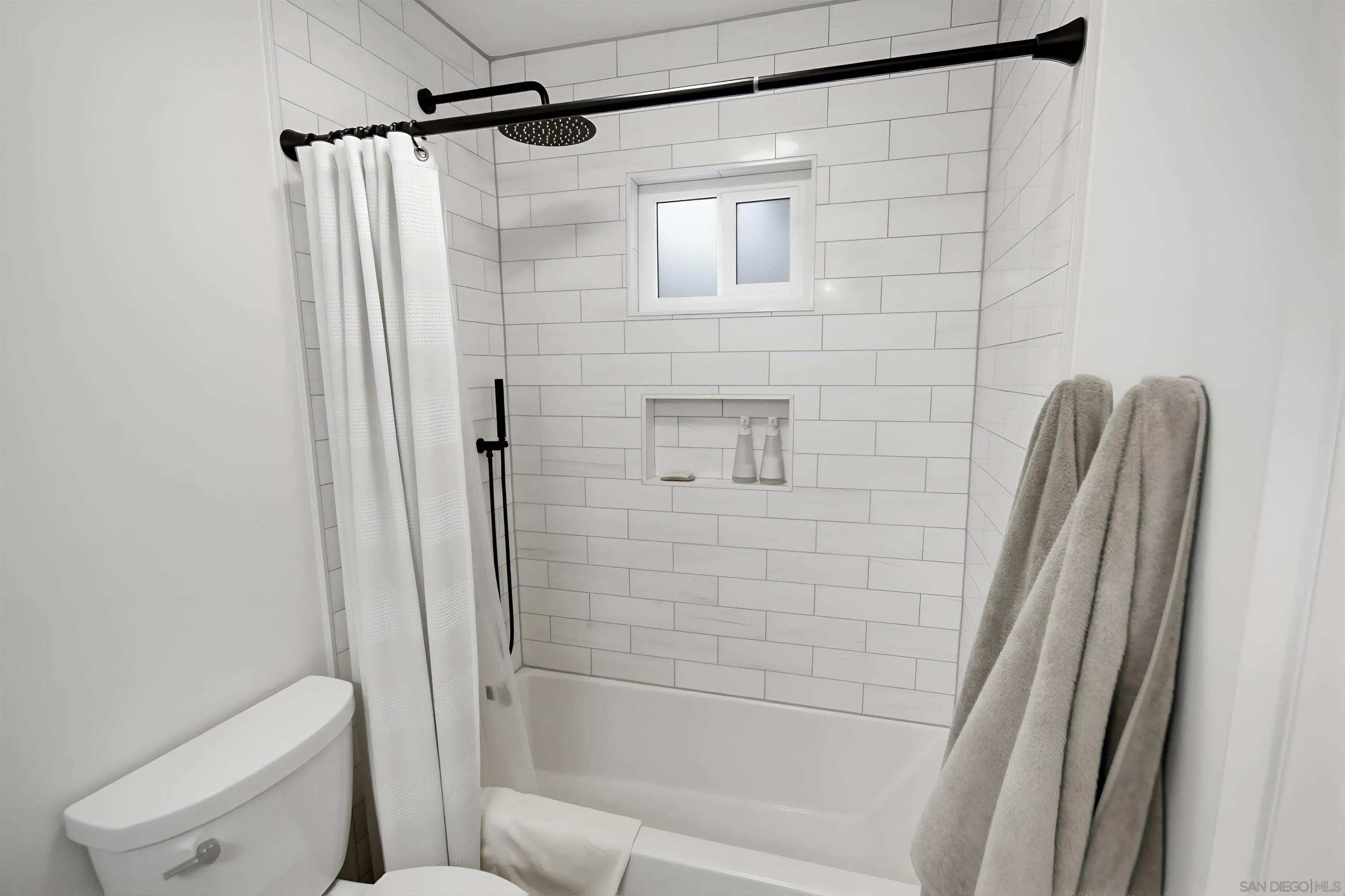 5822 Mission Center Road, Unit A San Diego, CA 92108 - Photo 30 of 35 a bathroom with a shower and a toilet