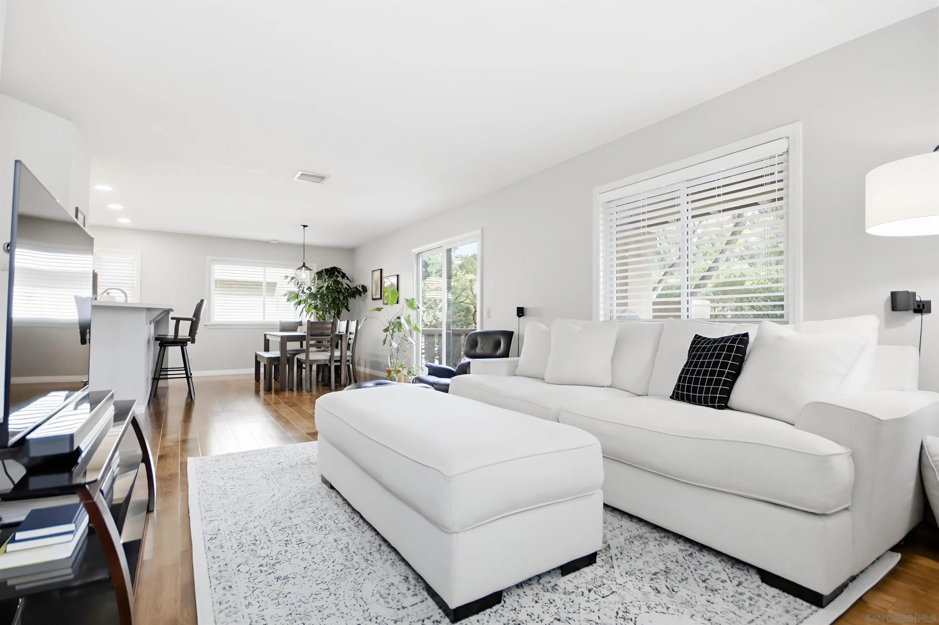 5822 Mission Center Road, Unit A San Diego, CA 92108 - Photo 3 of 35 a living room with furniture and a large window