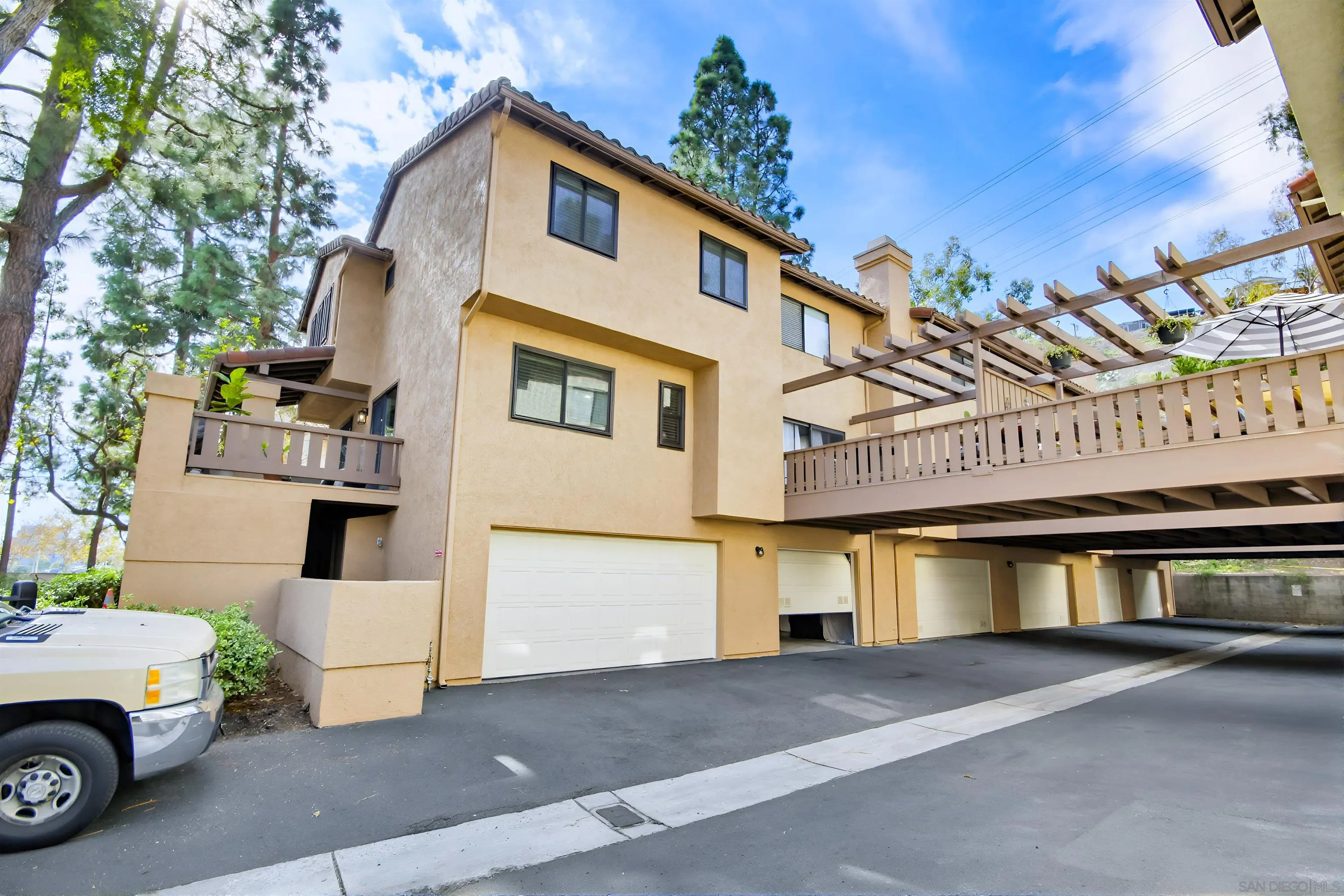 5822 Mission Center Road, Unit A San Diego, CA 92108 - Photo 33 of 35 a view of a car park in front of house