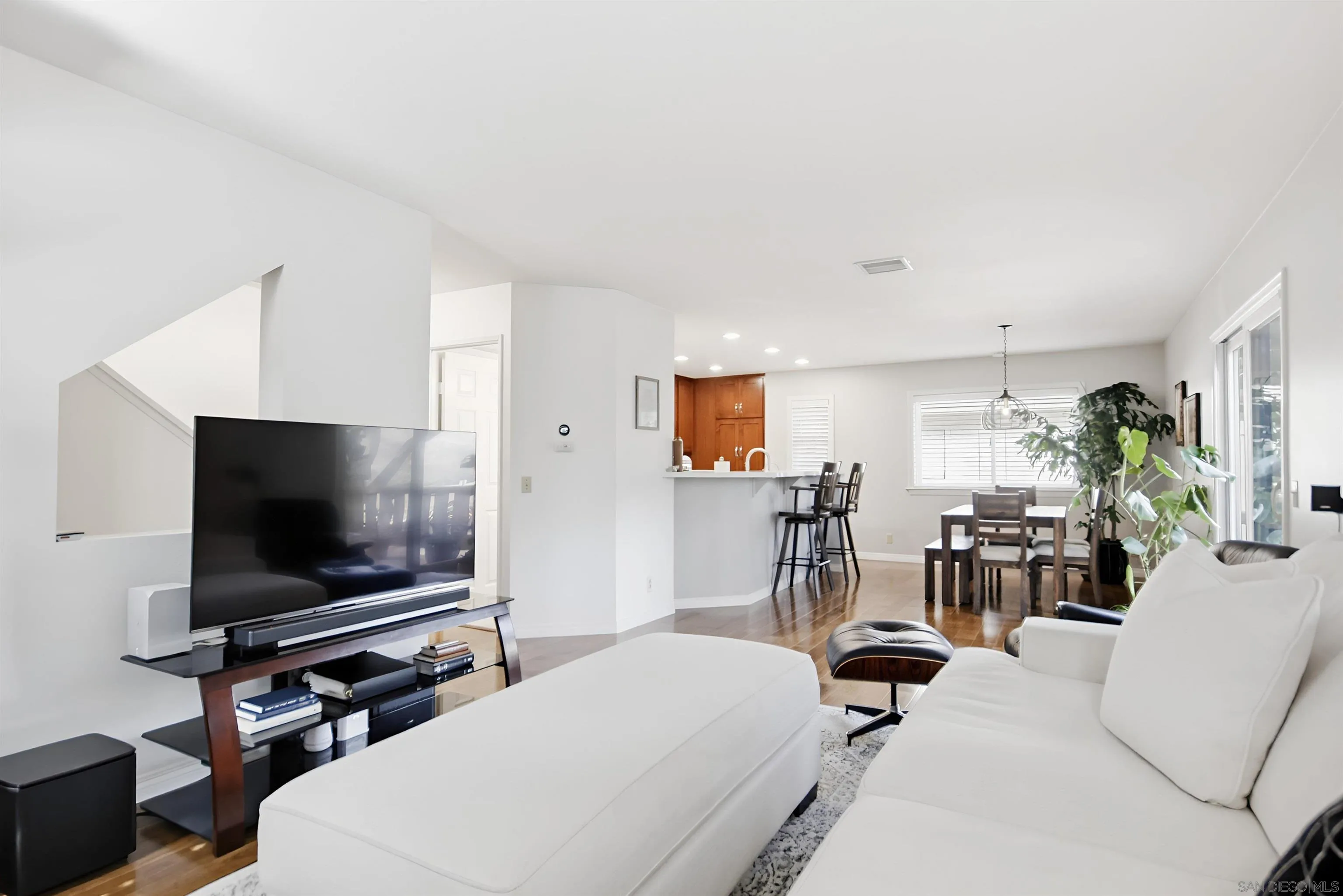 5822 Mission Center Road, Unit A San Diego, CA 92108 - Photo 4 of 35 a living room with furniture and a flat screen tv