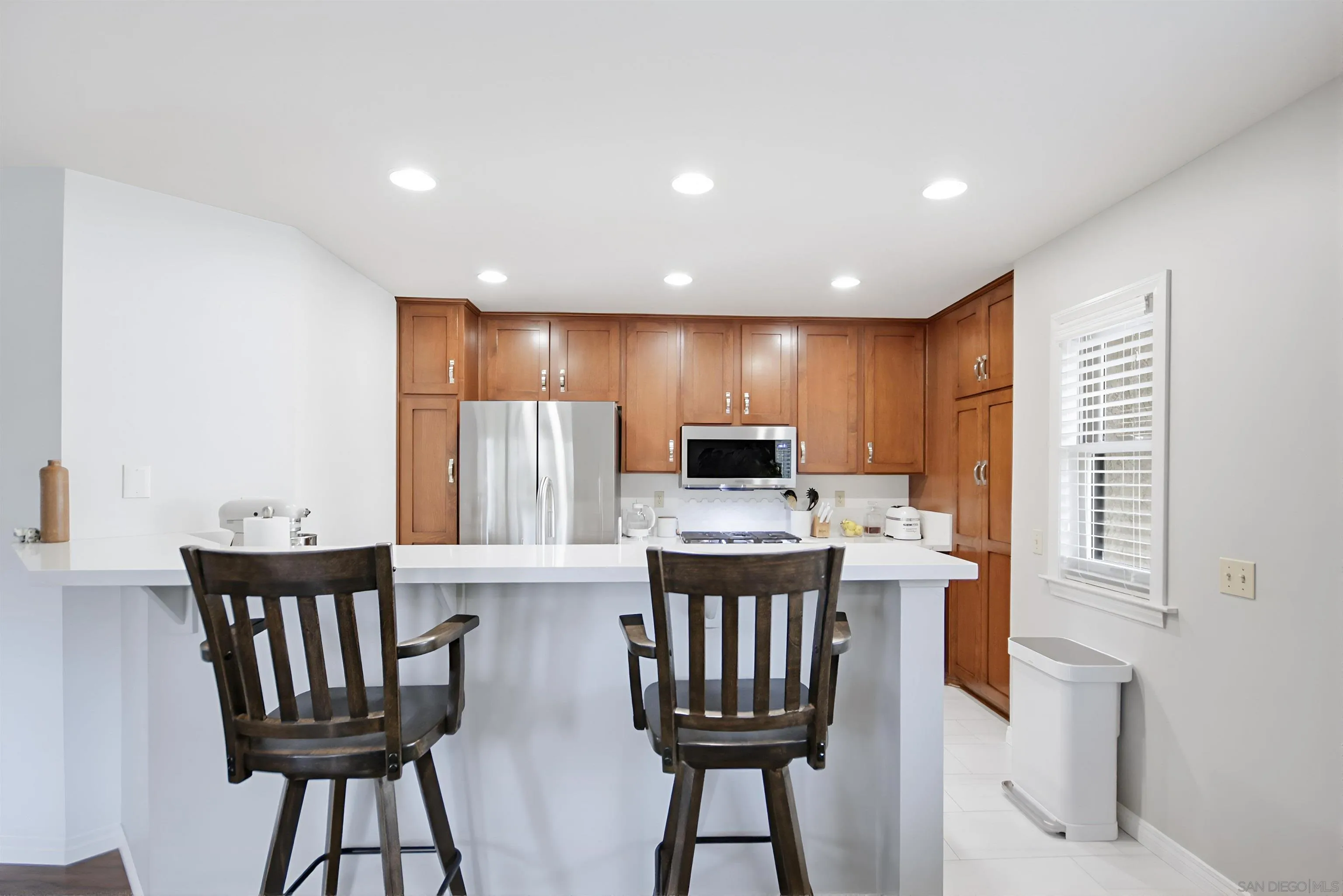 5822 Mission Center Road, Unit A San Diego, CA 92108 - Photo 8 of 35 a view of a dining room with furniture