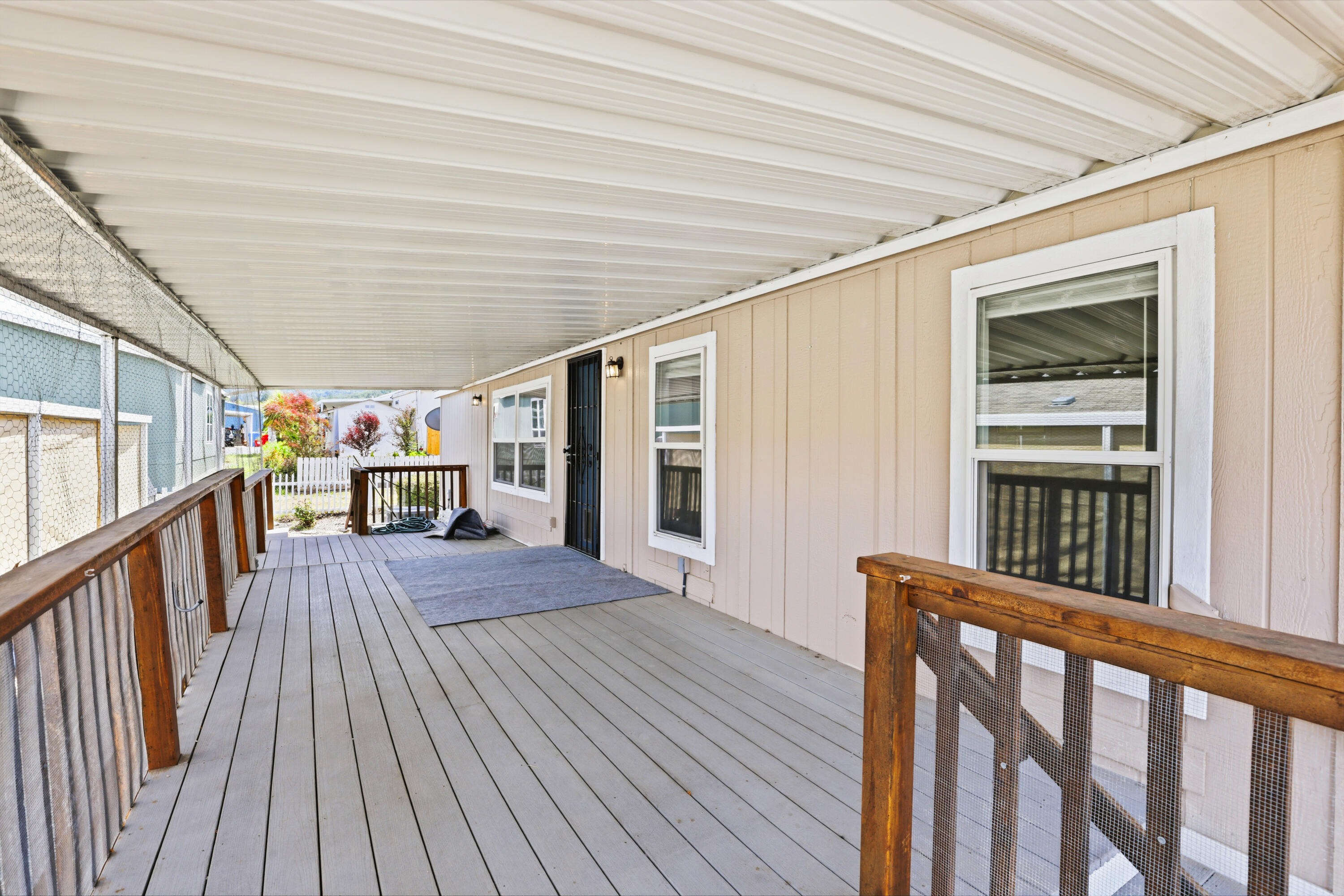 8401 Old Stage Road, Unit 16 Central Point, OR 97502 - Photo 4 of 23 a view of a balcony with wooden floor
