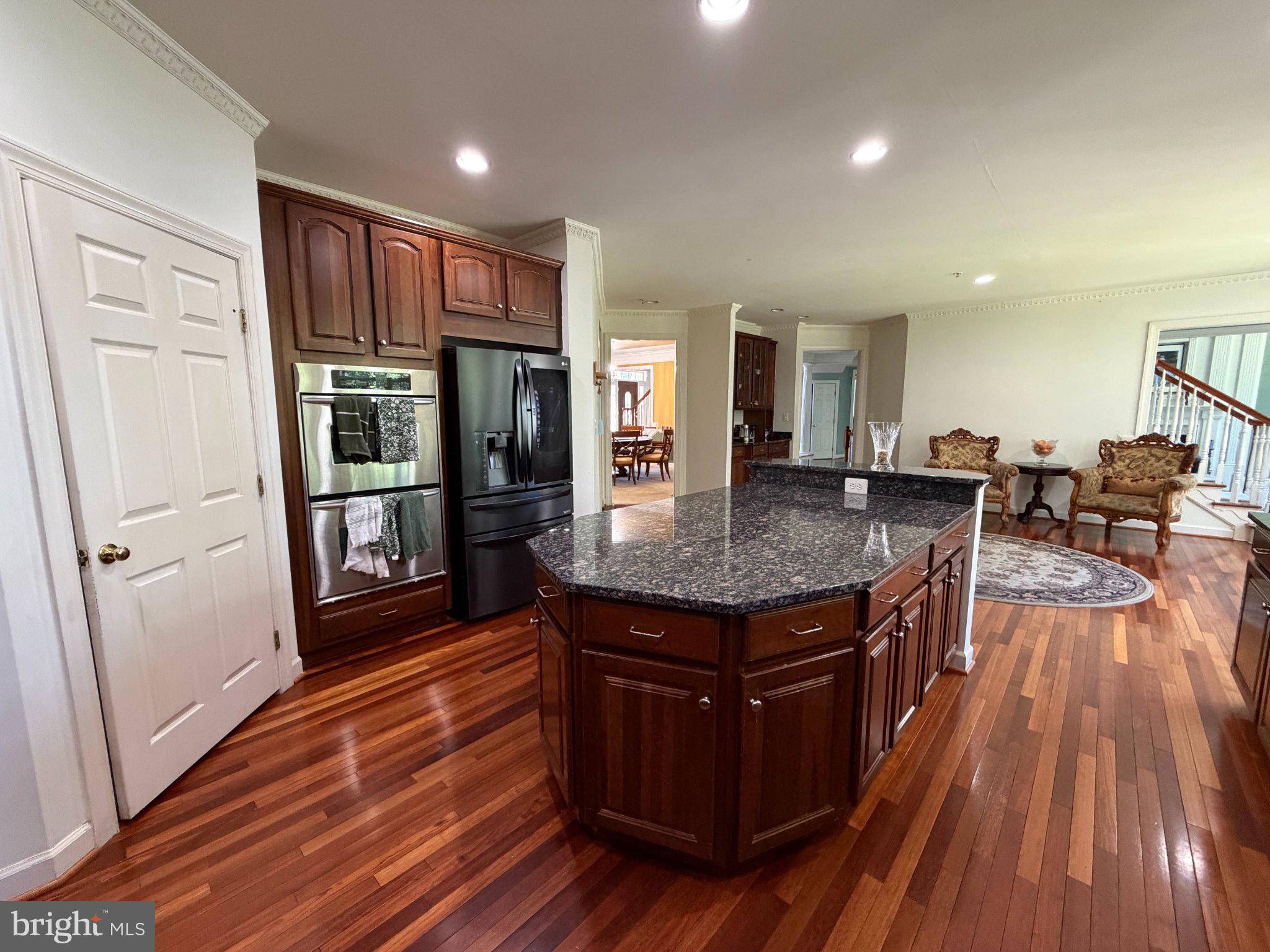 18724 Brooke Road Brinklow, MD 20862 - Photo 21 of 52 Elegant kitchen with rich wood tones.