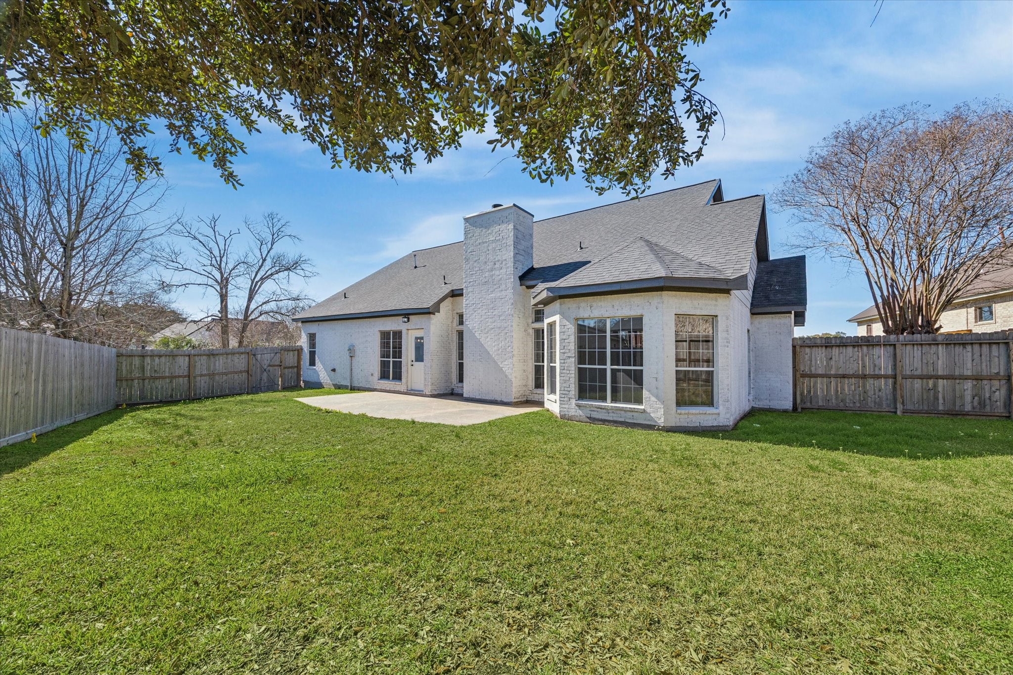 5437 Edgewater Court Willis, TX 77318 - Photo 29 of 29 a view of a yard in front of a house with large trees