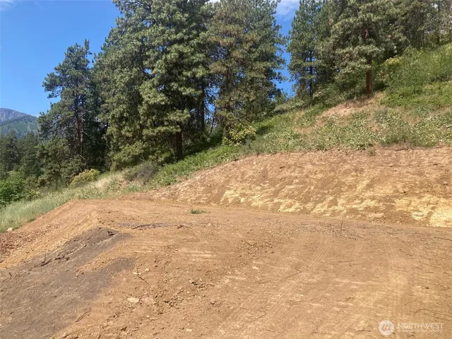 a view of white house with a yard