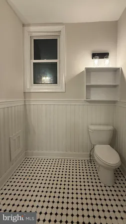 a bathroom with a toilet