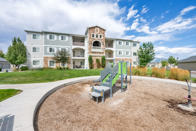 1823 North Crest Road Saratoga Springs, UT 84045 - Photo 2 of 18 Community jungle gym with a lawn
