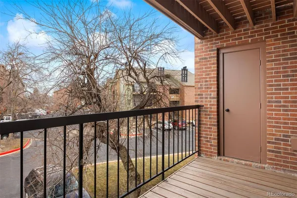 a view of a balcony with wooden floor