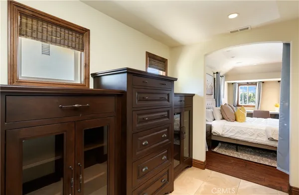 a bedroom with a bed and a dresser