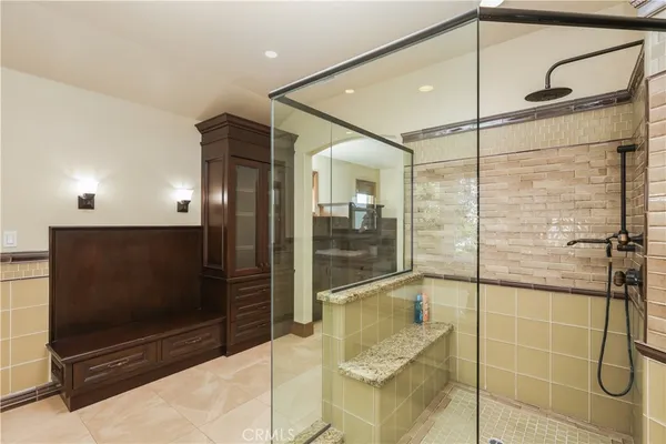 a bathroom with a shower and a sink