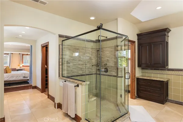 a bathroom with a shower and a sink