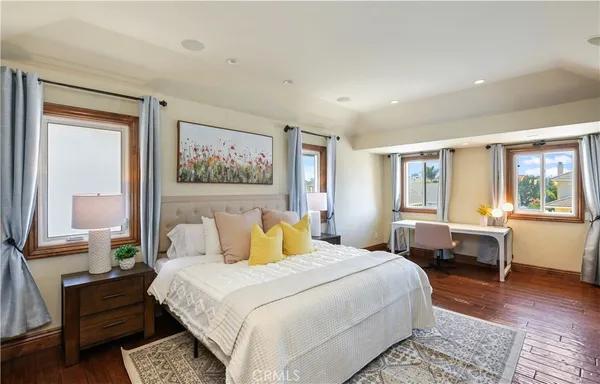 a bedroom with a large bed and a window