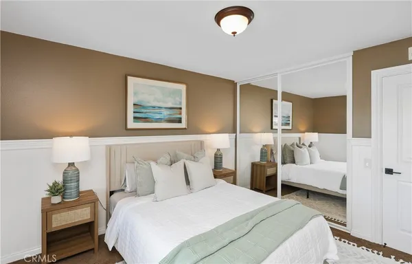 a bedroom with bed and window