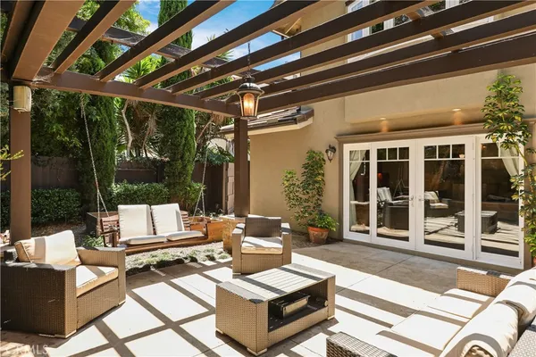 a outdoor space with patio the couches and a dining table with large garden view