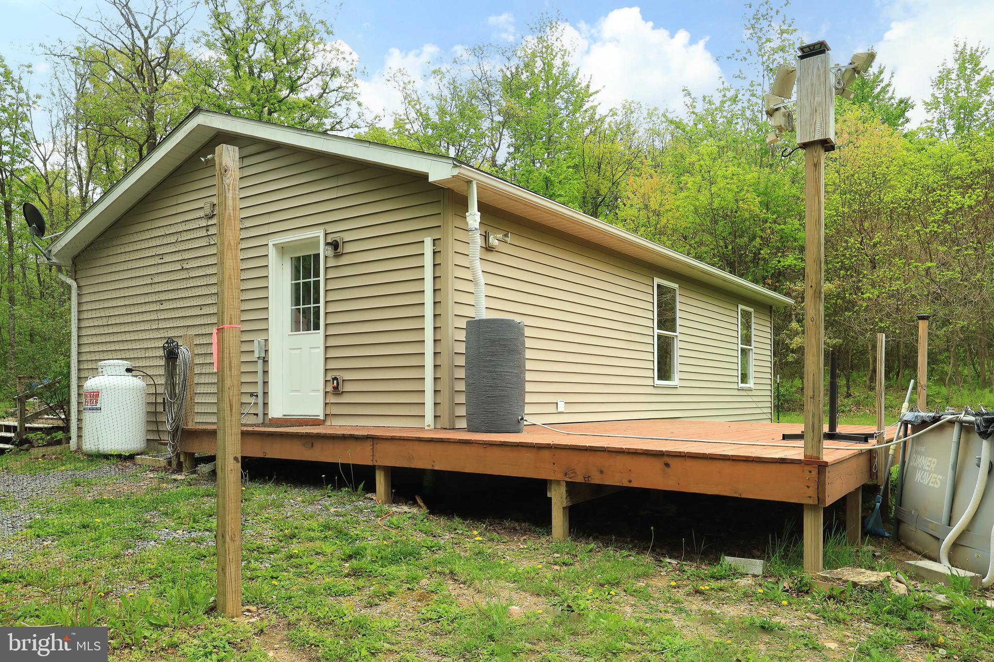 358 Buckridge Road Howard, PA 16841 - Photo 34 of 40 a backyard of a house with table and chairs