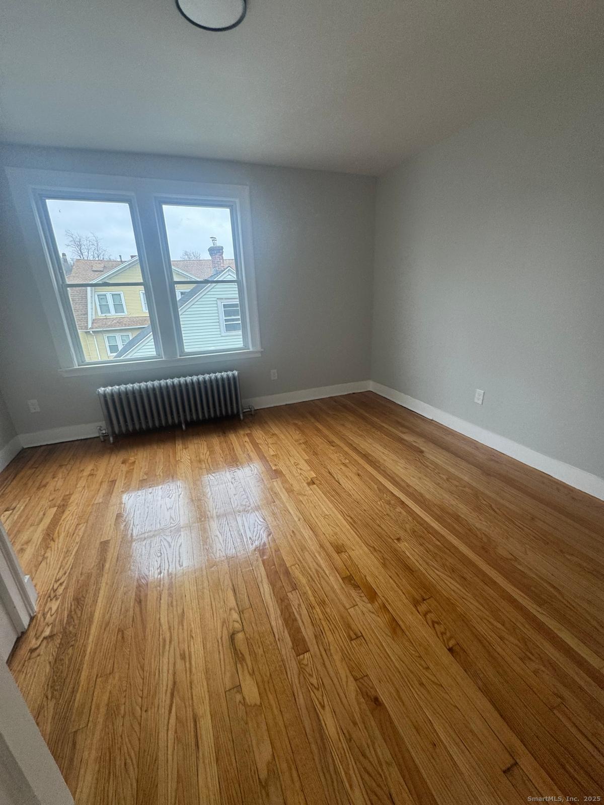60 Arnold Street Hartford, CT 06106 - Photo 3 of 5 a view of empty room with wooden floor