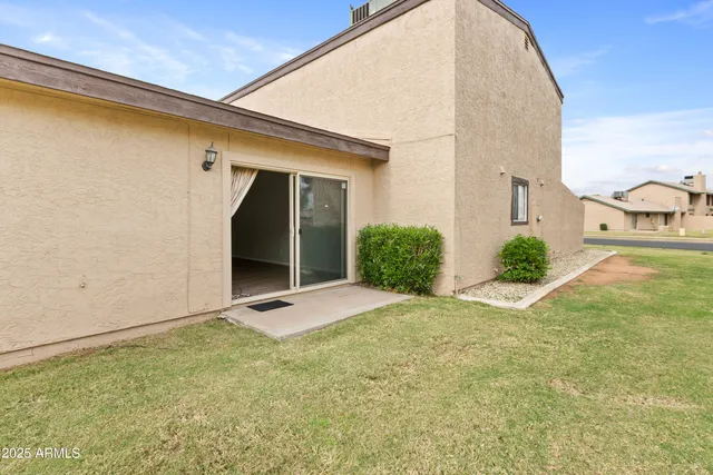 a view of a backyard of a house