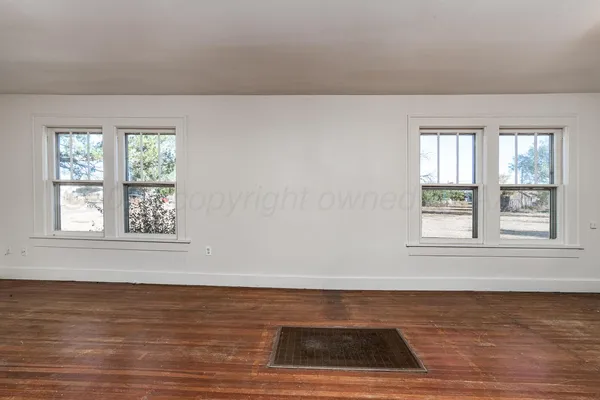 an empty room with window