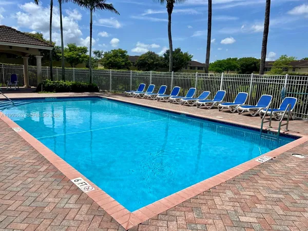 a view of swimming pool with a lounge chair
