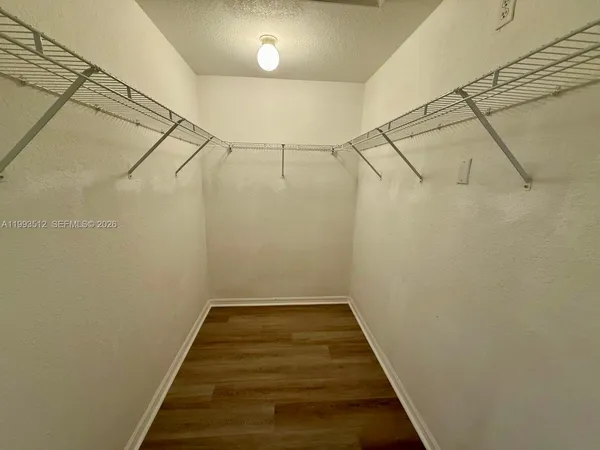 a view of a room with racks on the wall
