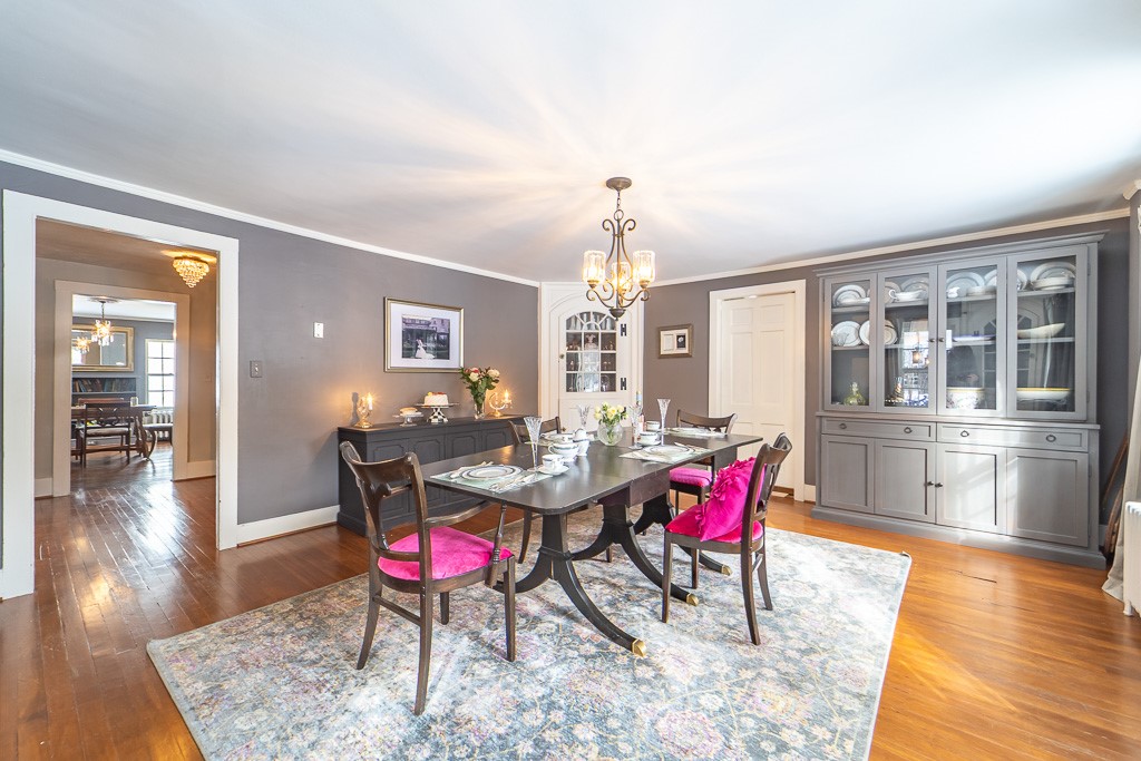 1237 Clover Street Brighton, NY 14610 - Photo 11 of 50 A formal dining room boasts crown molding, and a c